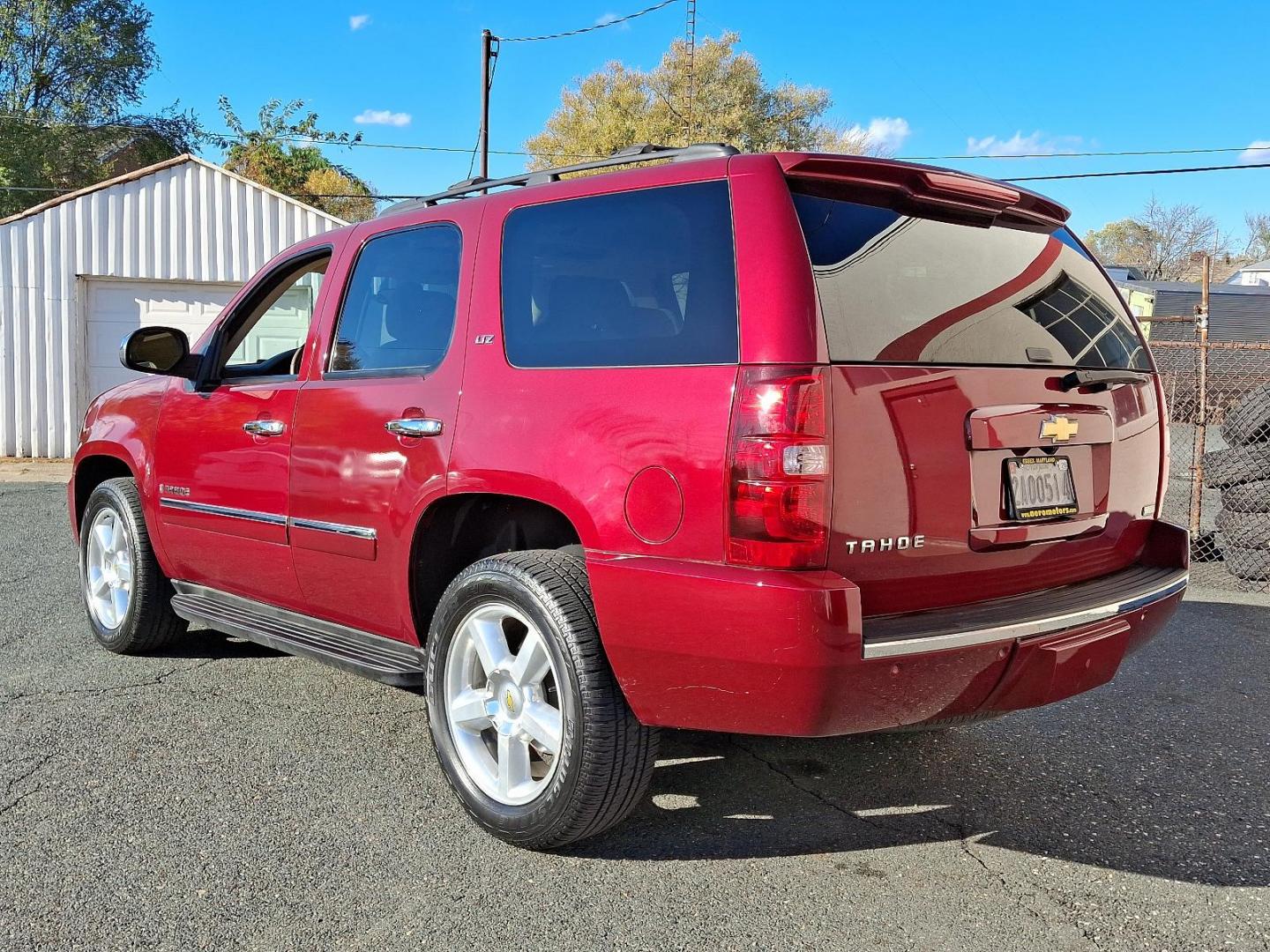 2009 Red Jewel Tintcoat - 80U /Light Cashmere/Dark Cashmere - 336 Chevrolet Tahoe LTZ (1GNFK33009J) with an ENGINE, VORTEC 5.3L V8 SFI FLEXFUEL engine, located at 50 Eastern Blvd., Essex, MD, 21221, (410) 686-3444, 39.304367, -76.484947 - Presenting an exquisite 2009 Chevrolet Tahoe LTZ 4WD 4dr 1500 LTZ that combines strength and style. Dressed in a sumptuous Red Jewel Tintcoat exterior paired with a tasteful Light Cashmere/Dark Cashmere interior, this SUV is a sight to behold. Under the hood, it boasts a powerful Vortec 5.3L V8 SFI - Photo#5