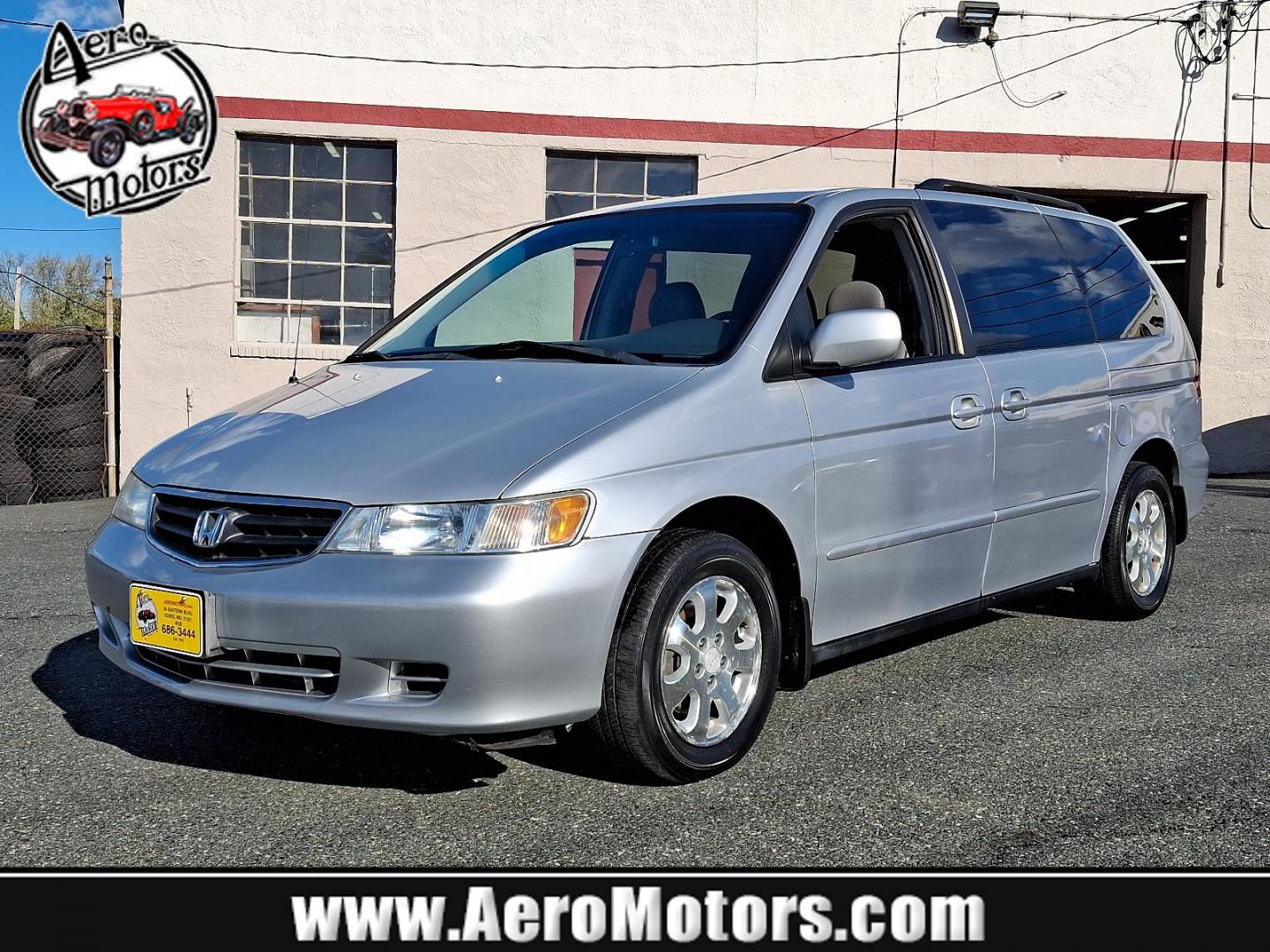 2004 Starlight Silver Metallic - SI /Quartz - QZ Honda Odyssey EX-L NAVI (5FNRL18764B) with an 3.5L SOHC MPFI 24-valve VTEC V6 engine engine, located at 50 Eastern Blvd., Essex, MD, 21221, (410) 686-3444, 39.304367, -76.484947 - Introducing the 2004 Honda Odyssey EX-L NAVI, a harmonious blend of style, function, and technology. Coated in an elegant gray exterior, this 5-door versatile ride pledges both aesthetic appeal and quality driving experiences. Its strong heart pulses in the form of a robust 3.5L SOHC MPFI 24-valve V - Photo#0