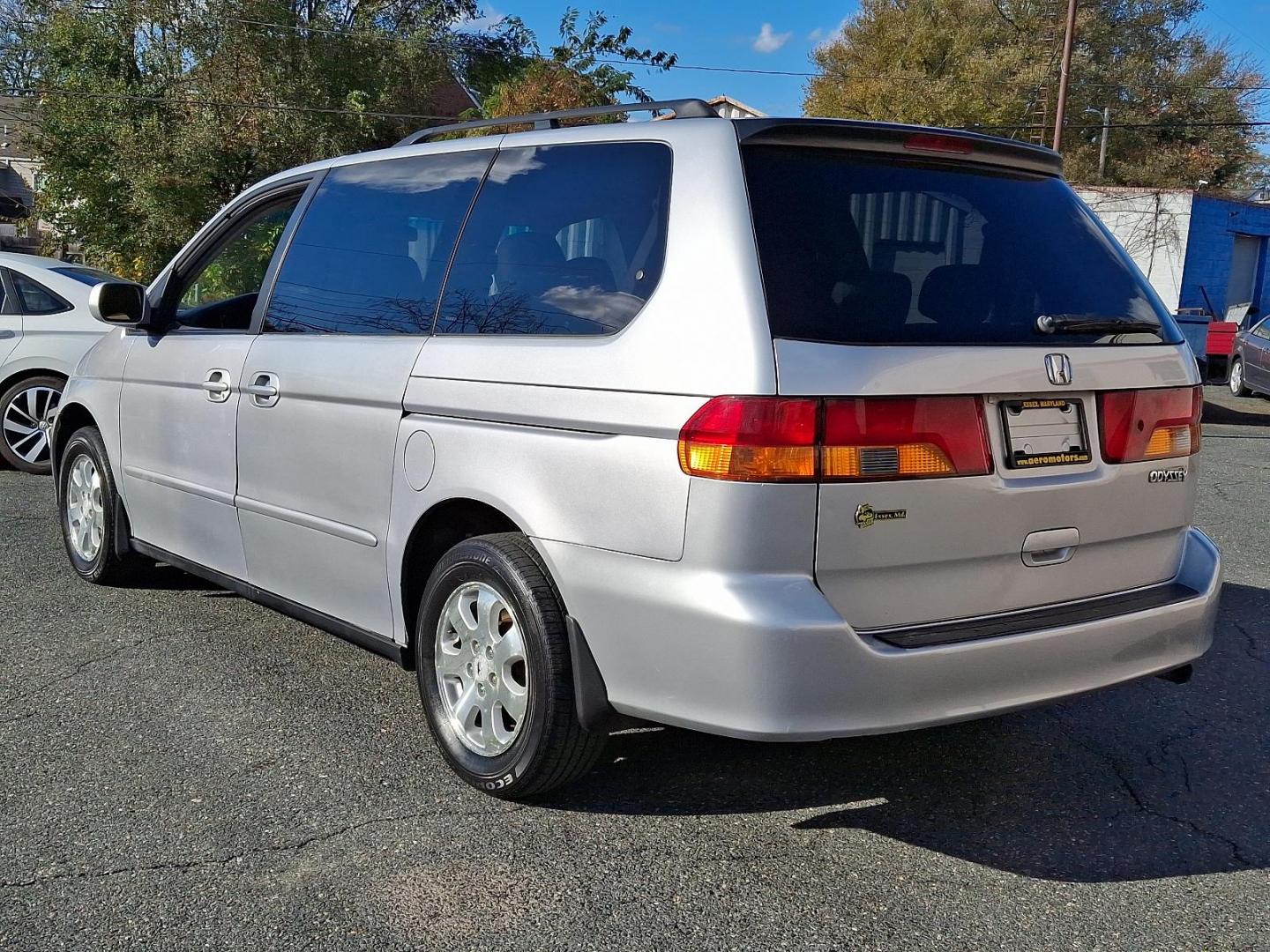 2004 Starlight Silver Metallic - SI /Quartz - QZ Honda Odyssey EX-L NAVI (5FNRL18764B) with an 3.5L SOHC MPFI 24-valve VTEC V6 engine engine, located at 50 Eastern Blvd., Essex, MD, 21221, (410) 686-3444, 39.304367, -76.484947 - Introducing the 2004 Honda Odyssey EX-L NAVI, a harmonious blend of style, function, and technology. Coated in an elegant gray exterior, this 5-door versatile ride pledges both aesthetic appeal and quality driving experiences. Its strong heart pulses in the form of a robust 3.5L SOHC MPFI 24-valve V - Photo#5