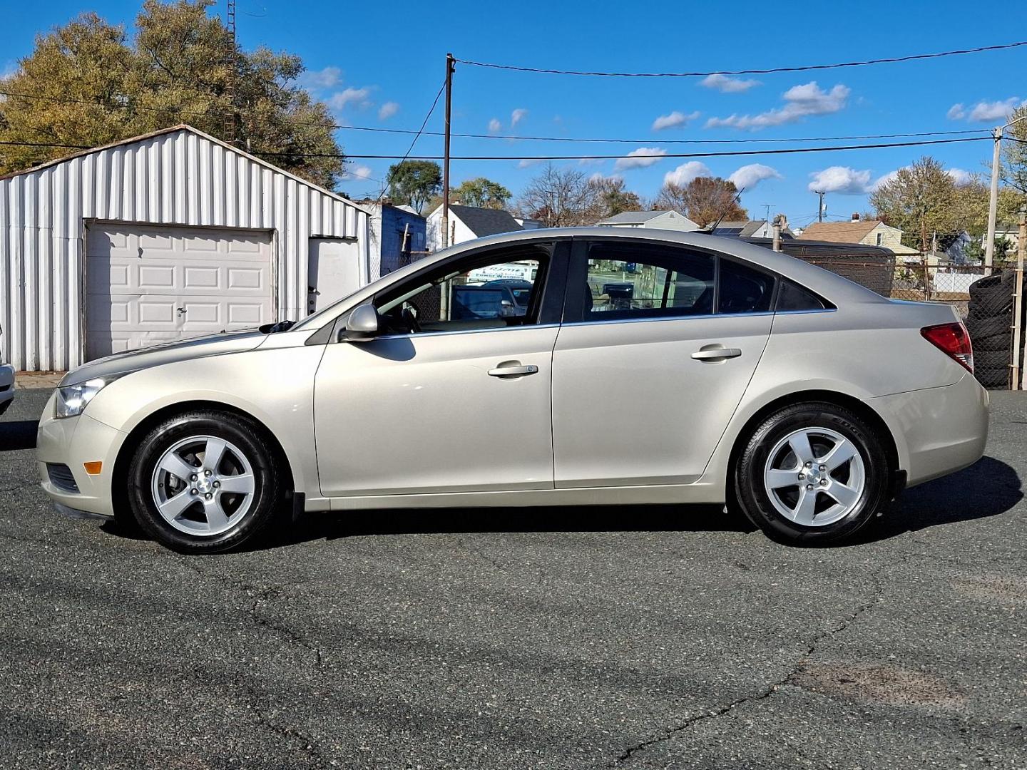 2014 Champagne Silver Metallic - GWT /Jet Black - ABX Chevrolet Cruze 1LT (1G1PC5SB7E7) with an ENGINE, ECOTEC TURBO 1.4L VARIABLE VALVE TIMING DOHC 4-CYLINDER SEQUENTIAL MFI engine, located at 50 Eastern Blvd., Essex, MD, 21221, (410) 686-3444, 39.304367, -76.484947 - Experience the allure of our stunning 2014 Chevrolet Cruze 1LT 4dr Sdn Auto 1LT, a fine blend of sophistication and performance. Dressed in a tasteful champagne silver metallic exterior that beautifully complements the opulent jet black interior, this vehicle represents class and power in equal meas - Photo#6