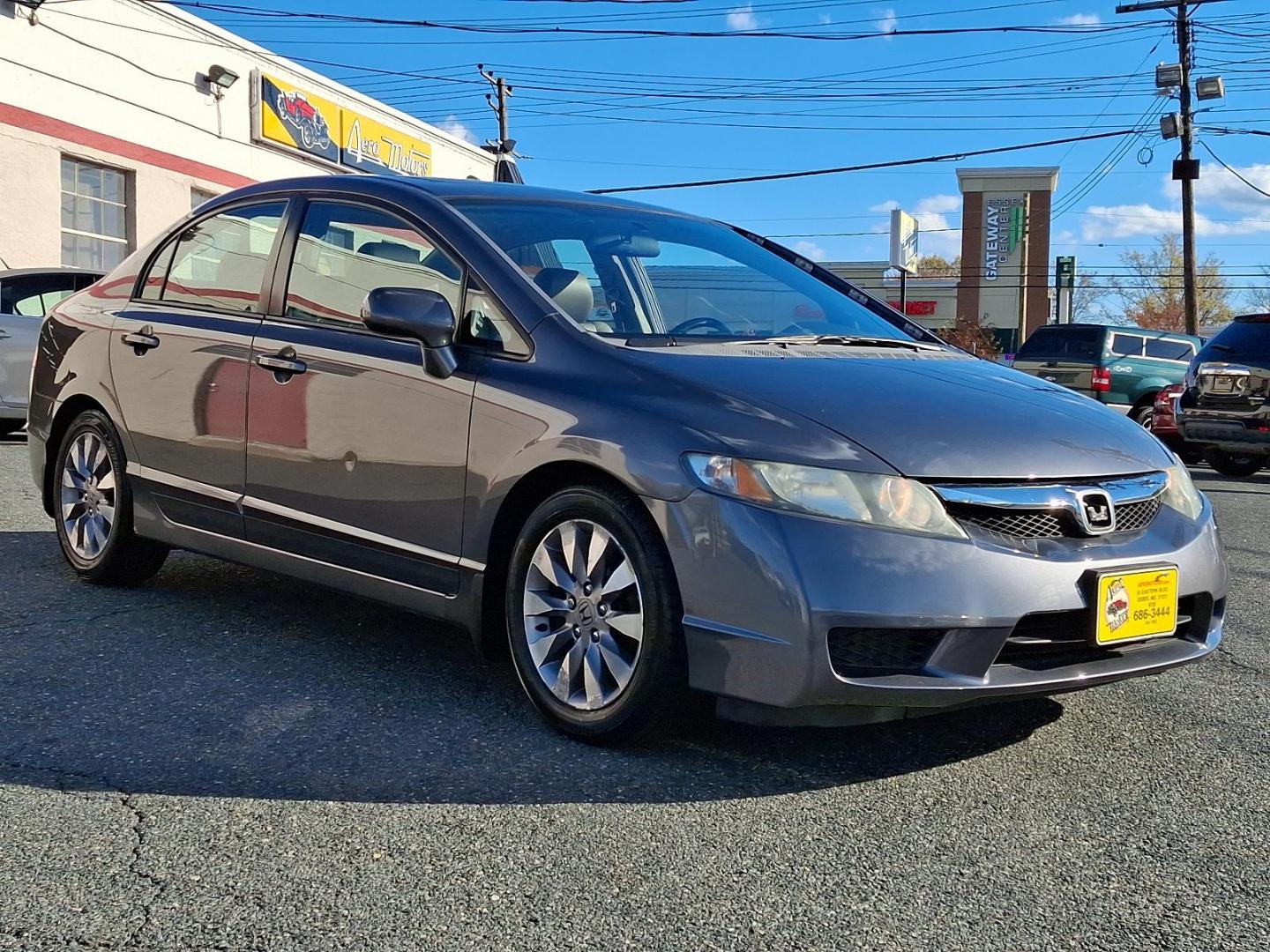 2009 Polished Metal Metallic - GY /Gray - GR Honda Civic Sdn EX-L (2HGFA16949H) with an 1.8L SOHC MPFI 16-valve i-VTEC I4 engine engine, located at 50 Eastern Blvd., Essex, MD, 21221, (410) 686-3444, 39.304367, -76.484947 - Introducing the 2009 Honda Civic Sedan EX-L with Navigation, a perfect blend of style, performance, and advanced technology. This attractive sedan comes finished in a sleek gray exterior, capturing attention and providing a timeless look. Powered by a fuel-efficient 1.8L SOHC MPFI 16-valve i-VTEC - Photo#2