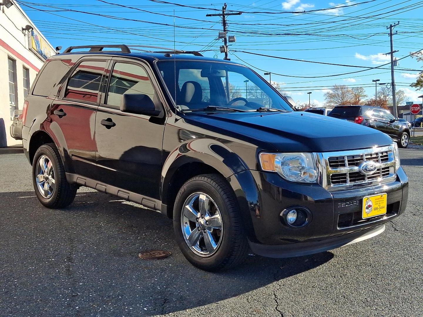 2011 Tuxedo Black Metallic - UH /Charcoal Black - W9 Ford Escape XLT (1FMCU0DG2BK) with an 3.0L V6 FLEX FUEL ENGINE engine, located at 50 Eastern Blvd., Essex, MD, 21221, (410) 686-3444, 39.304367, -76.484947 - Immerse yourself in the superior blend of functionality and style with our 2011 Ford Escape XLT Fwd 4dr XLT. Flaunting a polished black exterior, this vehicle makes a majestic road presence that leaves a lasting impression. Inside, it is powered by a robust 3.0L V6 Flex Fuel engine, delivering impre - Photo#2