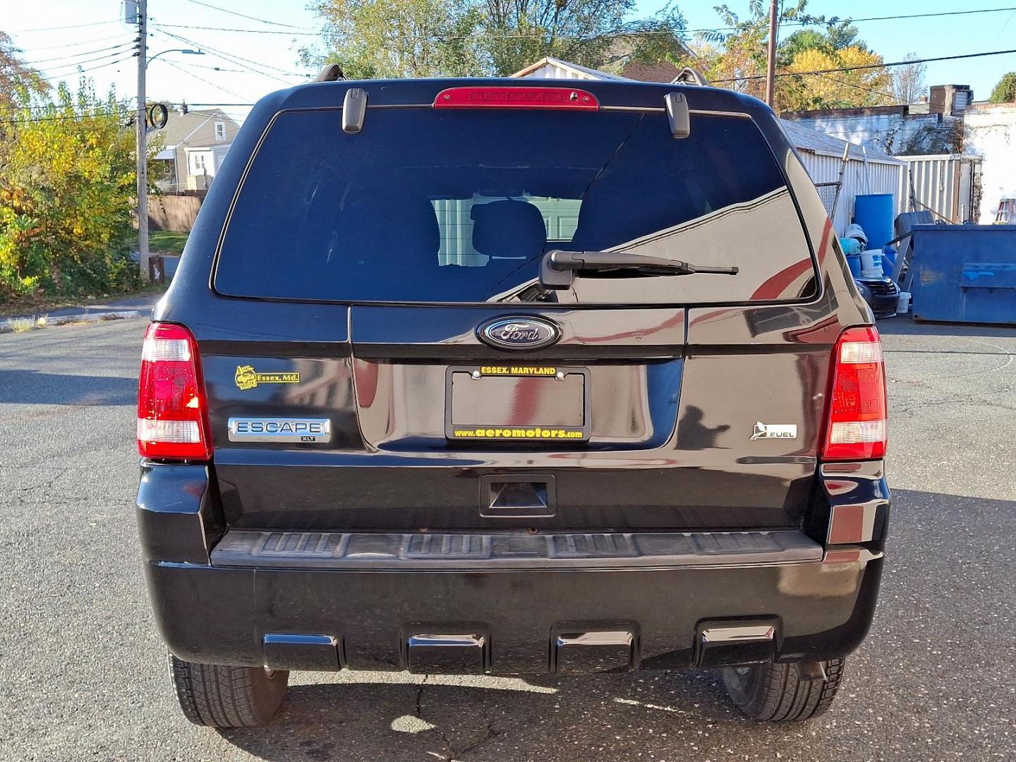 2011 Tuxedo Black Metallic - UH /Charcoal Black - W9 Ford Escape XLT (1FMCU0DG2BK) with an 3.0L V6 FLEX FUEL ENGINE engine, located at 50 Eastern Blvd., Essex, MD, 21221, (410) 686-3444, 39.304367, -76.484947 - Immerse yourself in the superior blend of functionality and style with our 2011 Ford Escape XLT Fwd 4dr XLT. Flaunting a polished black exterior, this vehicle makes a majestic road presence that leaves a lasting impression. Inside, it is powered by a robust 3.0L V6 Flex Fuel engine, delivering impre - Photo#4