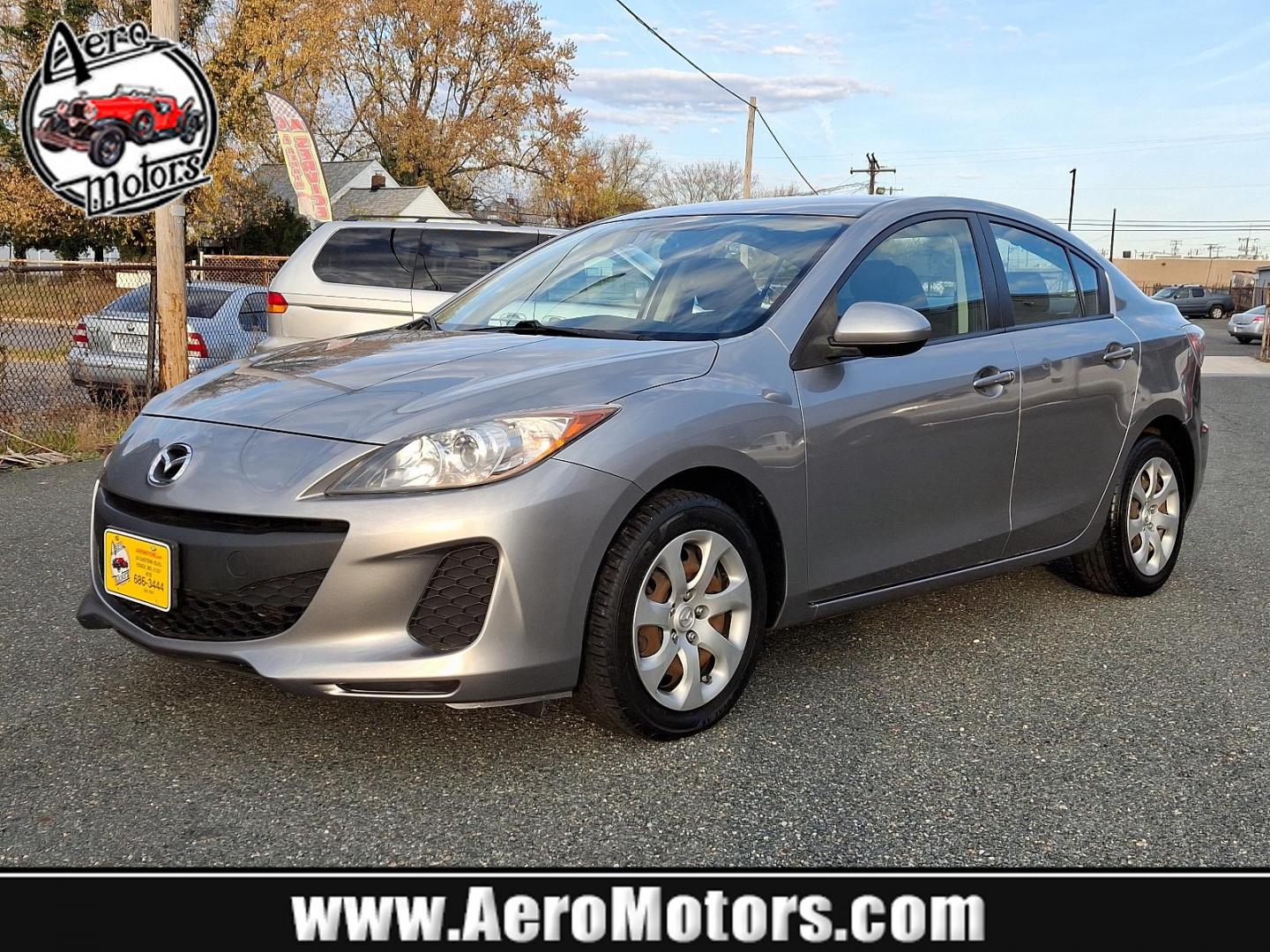 2013 Liquid Silver Metallic - 38P /Black - BU4 Mazda Mazda3 i SV (JM1BL1TG6D1) with an 2.0L DOHC EFI 16-valve I4 engine -inc: variable valve timing (VVT) engine, located at 50 Eastern Blvd., Essex, MD, 21221, (410) 686-3444, 39.304367, -76.484947 - Introducing the 2013 Mazda Mazda3 i SV, a blend of style, performance, and efficiency. With its sleek liquid silver metallic exterior and sophisticated black interior, this sedan is designed to make a lasting impression. Powered by a responsive 2.0L DOHC EFI 16-valve inline-4 engine, the Mazda3 boas - Photo#0