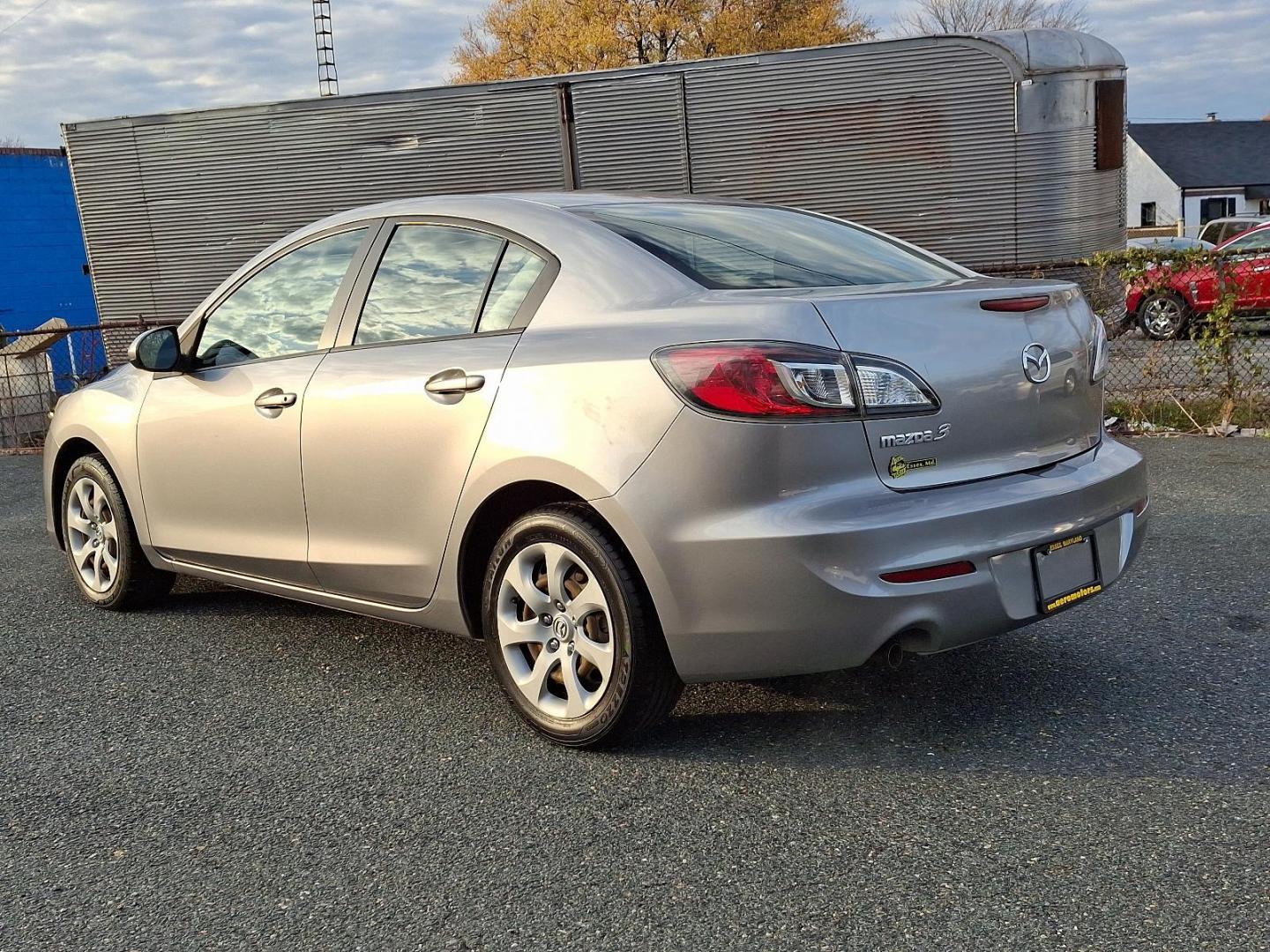 2013 Liquid Silver Metallic - 38P /Black - BU4 Mazda Mazda3 i SV (JM1BL1TG6D1) with an 2.0L DOHC EFI 16-valve I4 engine -inc: variable valve timing (VVT) engine, located at 50 Eastern Blvd., Essex, MD, 21221, (410) 686-3444, 39.304367, -76.484947 - Introducing the 2013 Mazda Mazda3 i SV, a blend of style, performance, and efficiency. With its sleek liquid silver metallic exterior and sophisticated black interior, this sedan is designed to make a lasting impression. Powered by a responsive 2.0L DOHC EFI 16-valve inline-4 engine, the Mazda3 boas - Photo#5