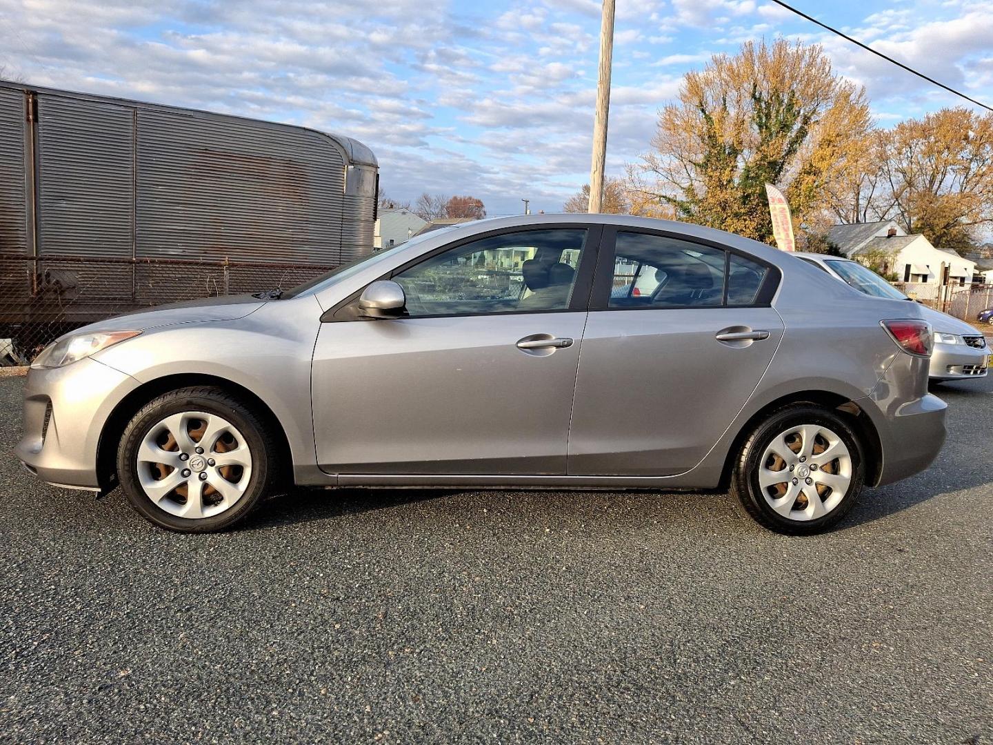 2013 Liquid Silver Metallic - 38P /Black - BU4 Mazda Mazda3 i SV (JM1BL1TG6D1) with an 2.0L DOHC EFI 16-valve I4 engine -inc: variable valve timing (VVT) engine, located at 50 Eastern Blvd., Essex, MD, 21221, (410) 686-3444, 39.304367, -76.484947 - Introducing the 2013 Mazda Mazda3 i SV, a blend of style, performance, and efficiency. With its sleek liquid silver metallic exterior and sophisticated black interior, this sedan is designed to make a lasting impression. Powered by a responsive 2.0L DOHC EFI 16-valve inline-4 engine, the Mazda3 boas - Photo#6