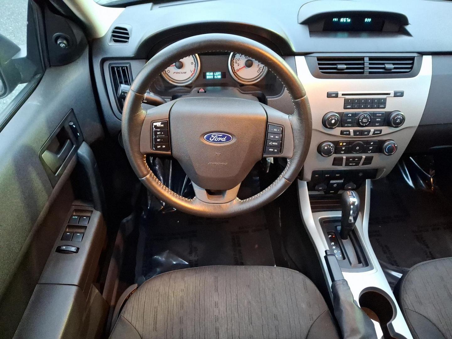 2009 Sterling Grey Metallic - UJ /Charcoal Black - FW Ford Focus SE (1FAHP35N09W) with an 2.0L DOHC 16-VALVE I4 DURATEC ENGINE engine, located at 50 Eastern Blvd., Essex, MD, 21221, (410) 686-3444, 39.304367, -76.484947 - Introducing the 2009 Ford Focus SE 4-Door Sedan-an embodiment of reliability and efficiency. Finished in a sleek gray exterior, this compact sedan combines modern style with practicality, making it an ideal choice for both urban commutes and long-distance travels. Under the hood, the Focus is power - Photo#10