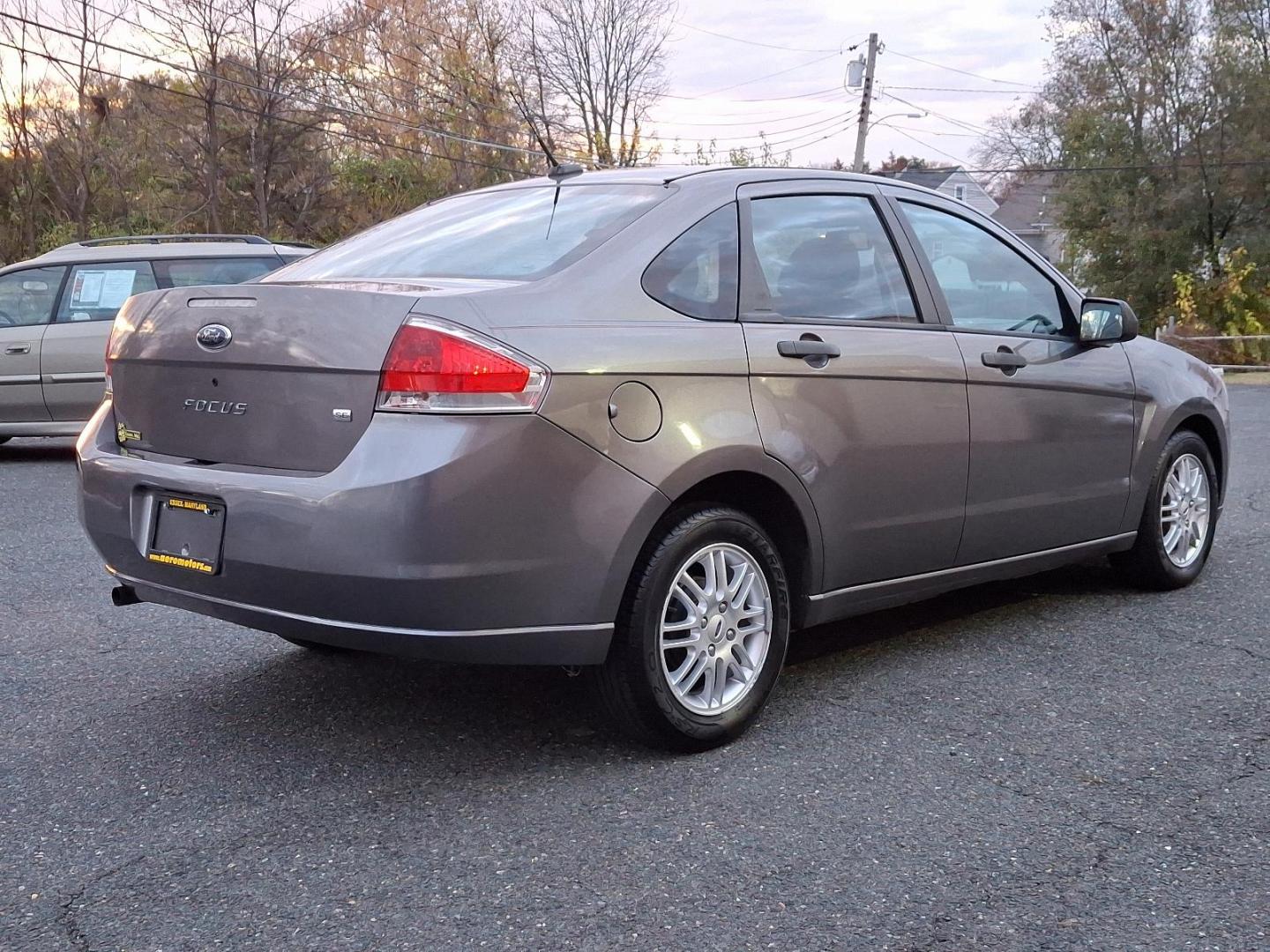 2009 Sterling Grey Metallic - UJ /Charcoal Black - FW Ford Focus SE (1FAHP35N09W) with an 2.0L DOHC 16-VALVE I4 DURATEC ENGINE engine, located at 50 Eastern Blvd., Essex, MD, 21221, (410) 686-3444, 39.304367, -76.484947 - Introducing the 2009 Ford Focus SE 4-Door Sedan-an embodiment of reliability and efficiency. Finished in a sleek gray exterior, this compact sedan combines modern style with practicality, making it an ideal choice for both urban commutes and long-distance travels. Under the hood, the Focus is power - Photo#3