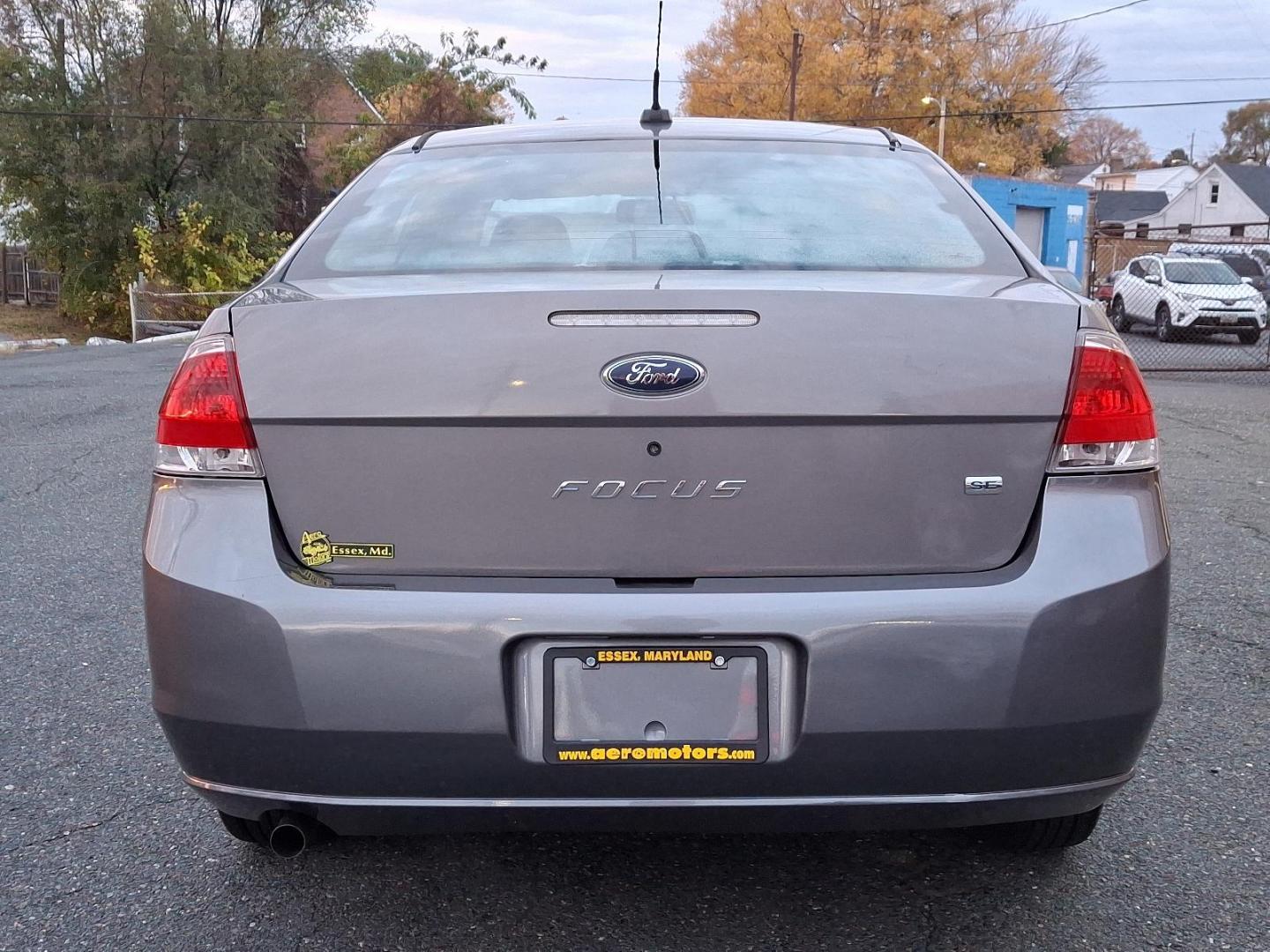 2009 Sterling Grey Metallic - UJ /Charcoal Black - FW Ford Focus SE (1FAHP35N09W) with an 2.0L DOHC 16-VALVE I4 DURATEC ENGINE engine, located at 50 Eastern Blvd., Essex, MD, 21221, (410) 686-3444, 39.304367, -76.484947 - Introducing the 2009 Ford Focus SE 4-Door Sedan-an embodiment of reliability and efficiency. Finished in a sleek gray exterior, this compact sedan combines modern style with practicality, making it an ideal choice for both urban commutes and long-distance travels. Under the hood, the Focus is power - Photo#4