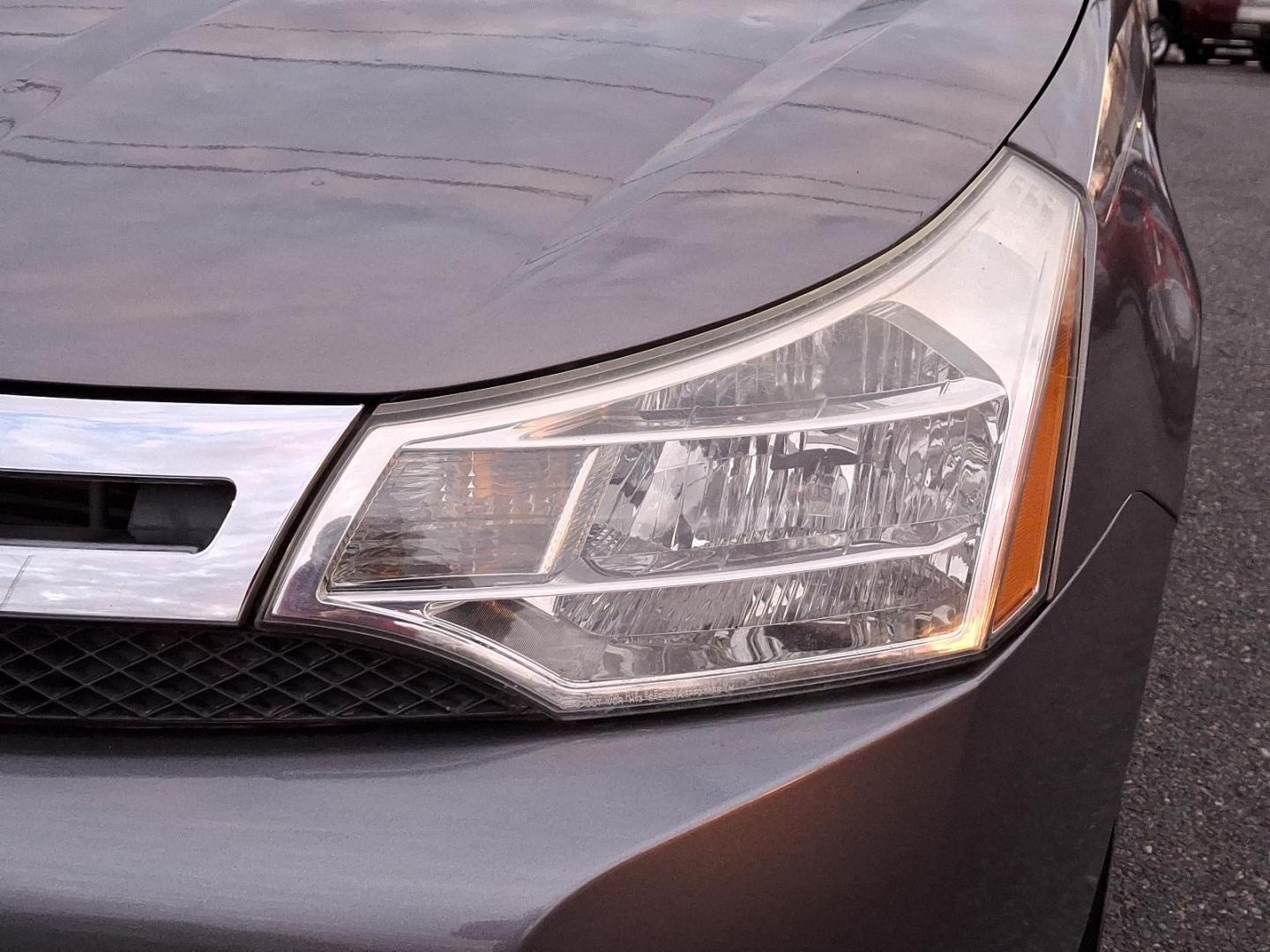 2009 Sterling Grey Metallic - UJ /Charcoal Black - FW Ford Focus SE (1FAHP35N09W) with an 2.0L DOHC 16-VALVE I4 DURATEC ENGINE engine, located at 50 Eastern Blvd., Essex, MD, 21221, (410) 686-3444, 39.304367, -76.484947 - Introducing the 2009 Ford Focus SE 4-Door Sedan-an embodiment of reliability and efficiency. Finished in a sleek gray exterior, this compact sedan combines modern style with practicality, making it an ideal choice for both urban commutes and long-distance travels. Under the hood, the Focus is power - Photo#8