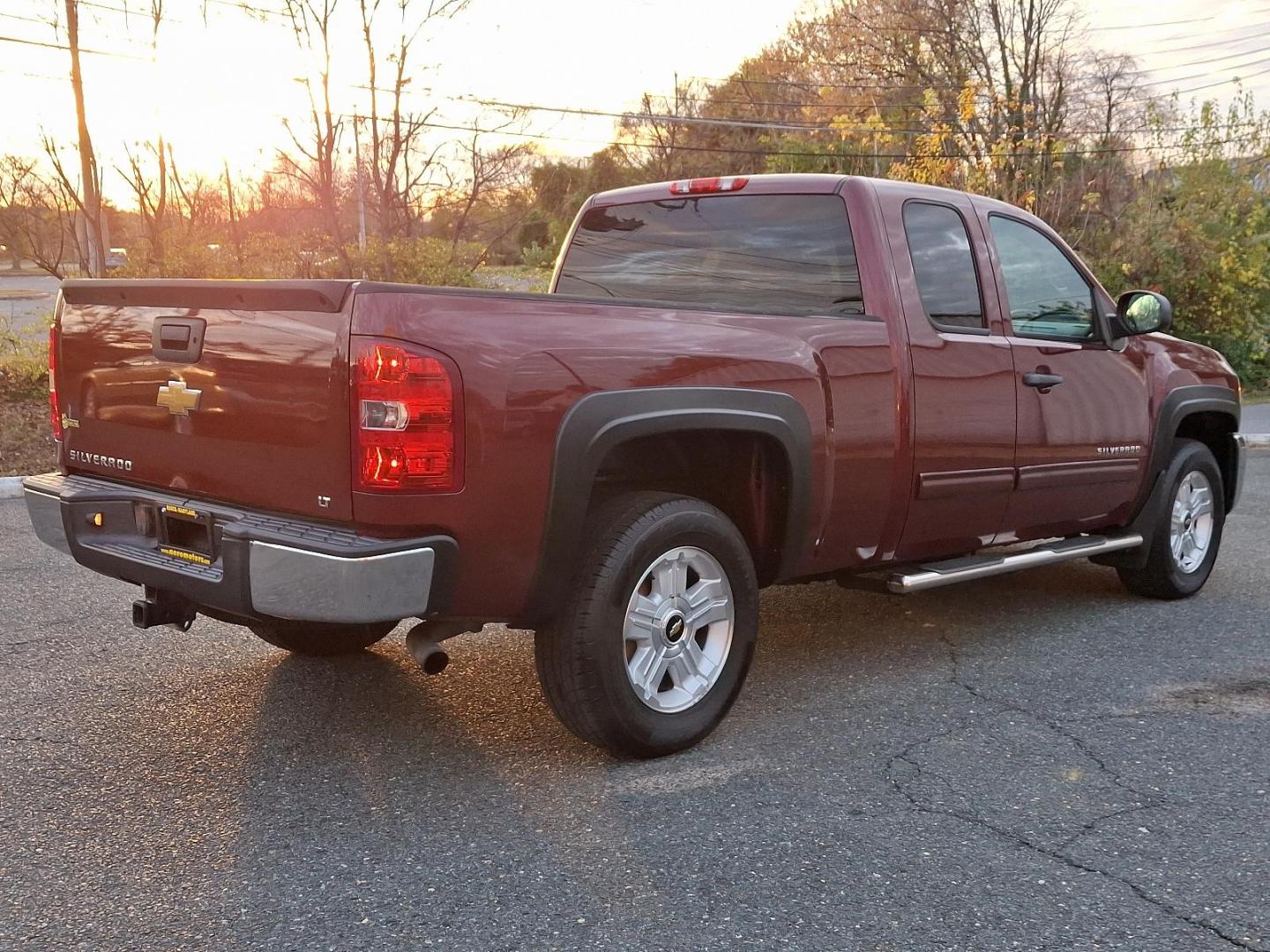 2013 Deep Ruby Metallic - 66U /Ebony - 193 Chevrolet Silverado 1500 LT (1GCRKSE70DZ) with an ENGINE, VORTEC 5.3L VARIABLE VALVE TIMING V8 SFI FLEXFUEL WITH ACTIVE FUEL MANAGEMENT engine, located at 50 Eastern Blvd., Essex, MD, 21221, (410) 686-3444, 39.304367, -76.484947 - Introducing the 2013 Chevrolet Silverado 1500 LT 4WD Extended Cab, a perfect blend of rugged capability and refined comfort. Dressed in a striking Deep Ruby Metallic exterior, this truck boasts an elegant yet aggressive stance that turns heads on and off the road. Step inside to find a spacious ebon - Photo#3