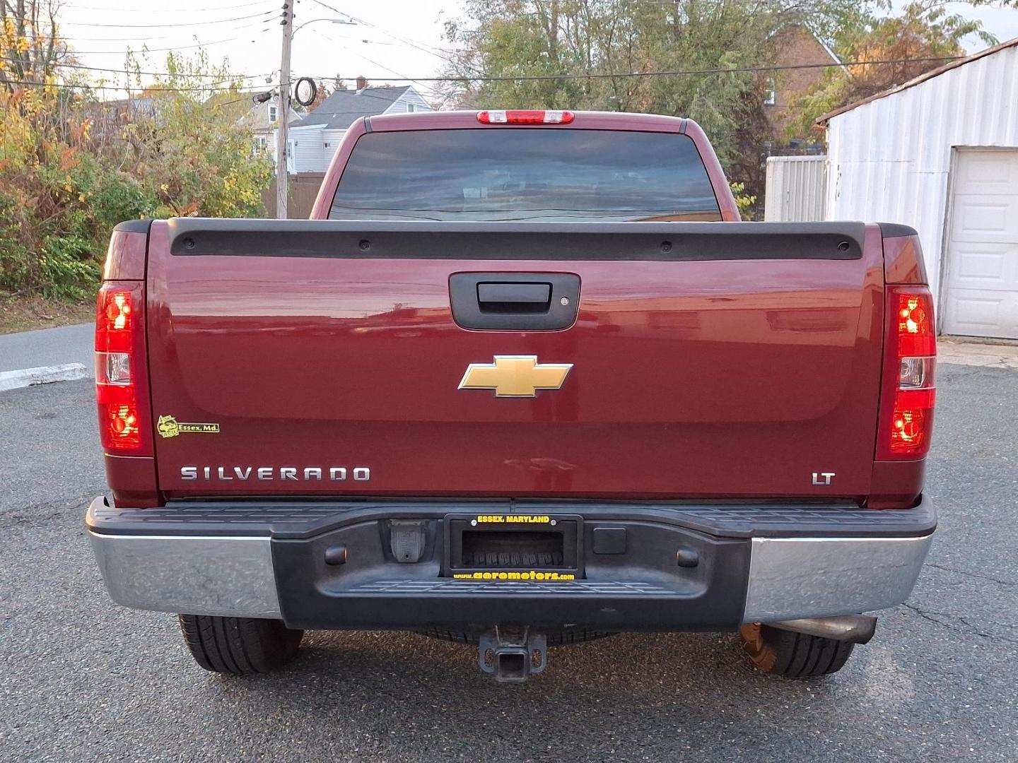 2013 Deep Ruby Metallic - 66U /Ebony - 193 Chevrolet Silverado 1500 LT (1GCRKSE70DZ) with an ENGINE, VORTEC 5.3L VARIABLE VALVE TIMING V8 SFI FLEXFUEL WITH ACTIVE FUEL MANAGEMENT engine, located at 50 Eastern Blvd., Essex, MD, 21221, (410) 686-3444, 39.304367, -76.484947 - Introducing the 2013 Chevrolet Silverado 1500 LT 4WD Extended Cab, a perfect blend of rugged capability and refined comfort. Dressed in a striking Deep Ruby Metallic exterior, this truck boasts an elegant yet aggressive stance that turns heads on and off the road. Step inside to find a spacious ebon - Photo#4