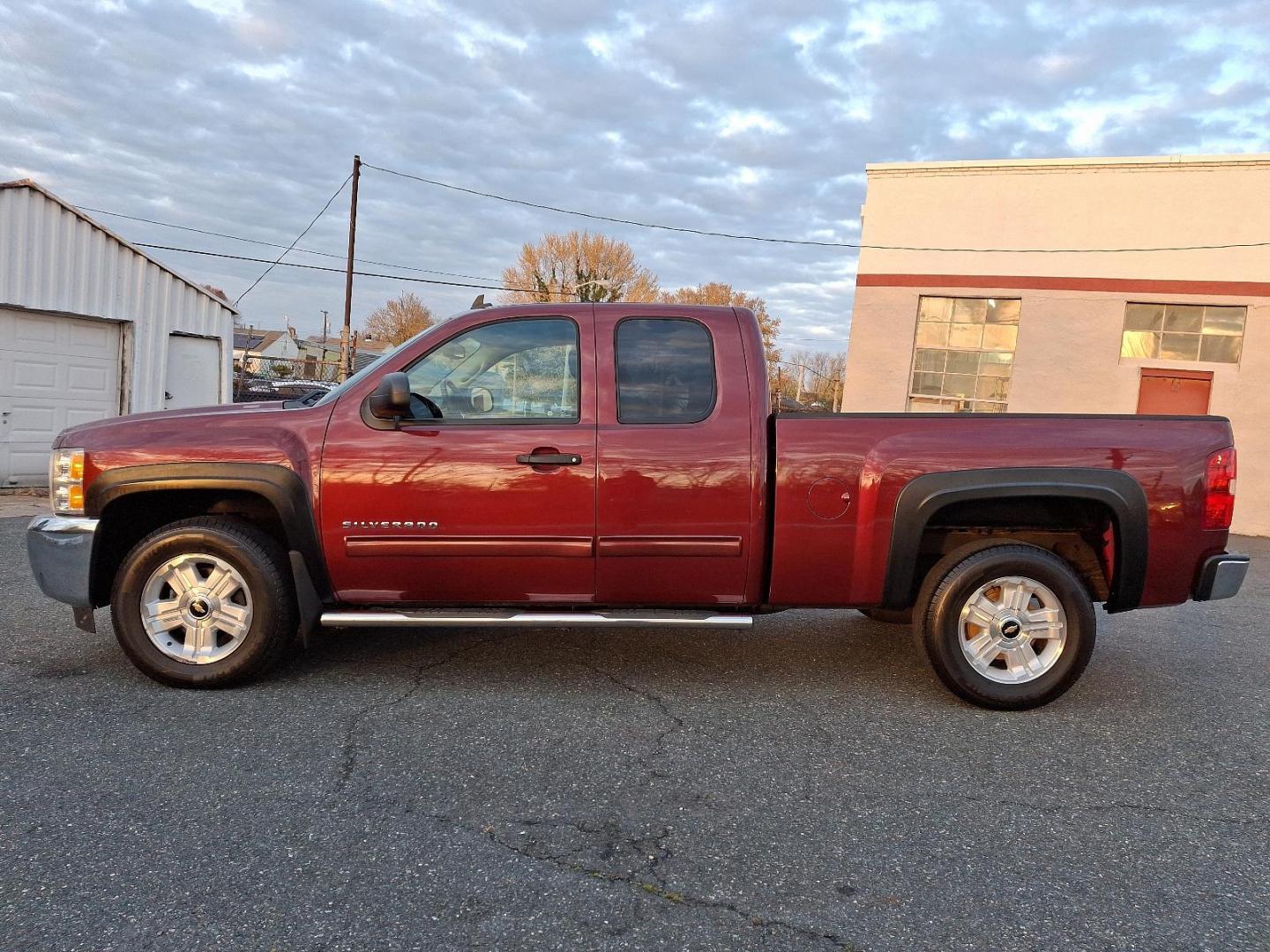 2013 Deep Ruby Metallic - 66U /Ebony - 193 Chevrolet Silverado 1500 LT (1GCRKSE70DZ) with an ENGINE, VORTEC 5.3L VARIABLE VALVE TIMING V8 SFI FLEXFUEL WITH ACTIVE FUEL MANAGEMENT engine, located at 50 Eastern Blvd., Essex, MD, 21221, (410) 686-3444, 39.304367, -76.484947 - Introducing the 2013 Chevrolet Silverado 1500 LT 4WD Extended Cab, a perfect blend of rugged capability and refined comfort. Dressed in a striking Deep Ruby Metallic exterior, this truck boasts an elegant yet aggressive stance that turns heads on and off the road. Step inside to find a spacious ebon - Photo#6