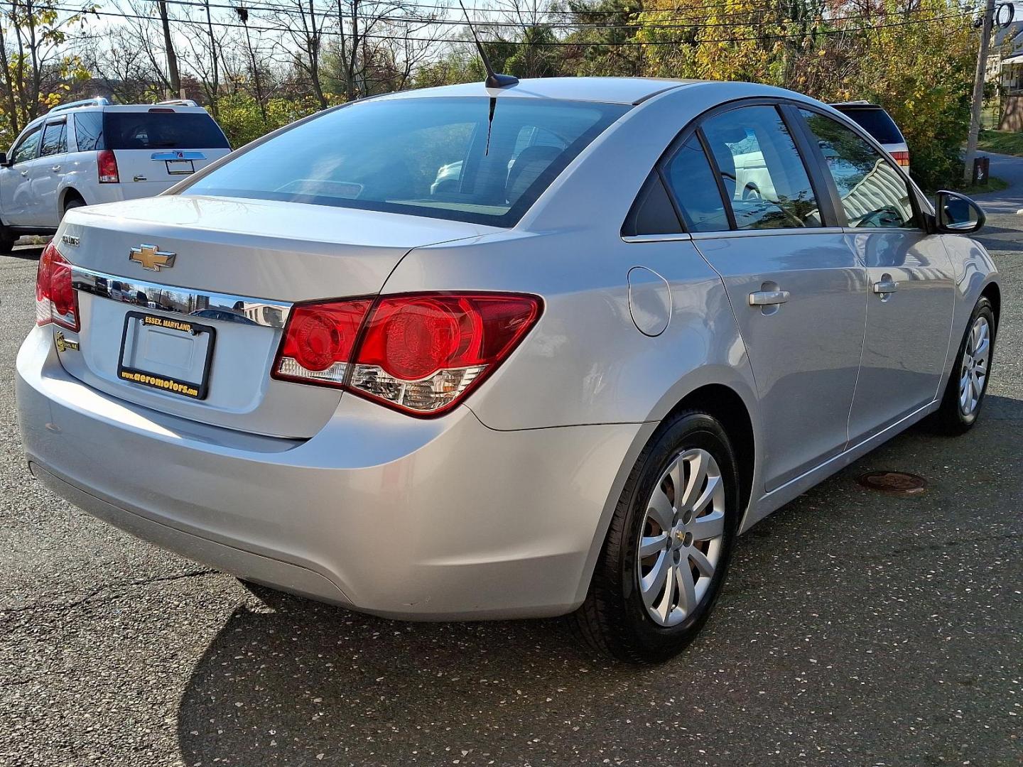 2011 Silver Ice Metallic - GAN /Jet Black/Medium Titanium - AFB Chevrolet Cruze LS (1G1PC5SH6B7) with an ENGINE, ECOTEC 1.8L VARIABLE VALVE TIMING DOHC 4-CYLINDER SEQUENTIAL MFI engine, located at 50 Eastern Blvd., Essex, MD, 21221, (410) 686-3444, 39.304367, -76.484947 - Discover the perfect blend of style and efficiency with this 2011 Chevrolet Cruze LS. Presented in a striking Silver Ice Metallic exterior, this four-door sedan is designed to turn heads while providing a comfortable and refined driving experience. Inside, you'll find a sophisticated Jet Black and M - Photo#3