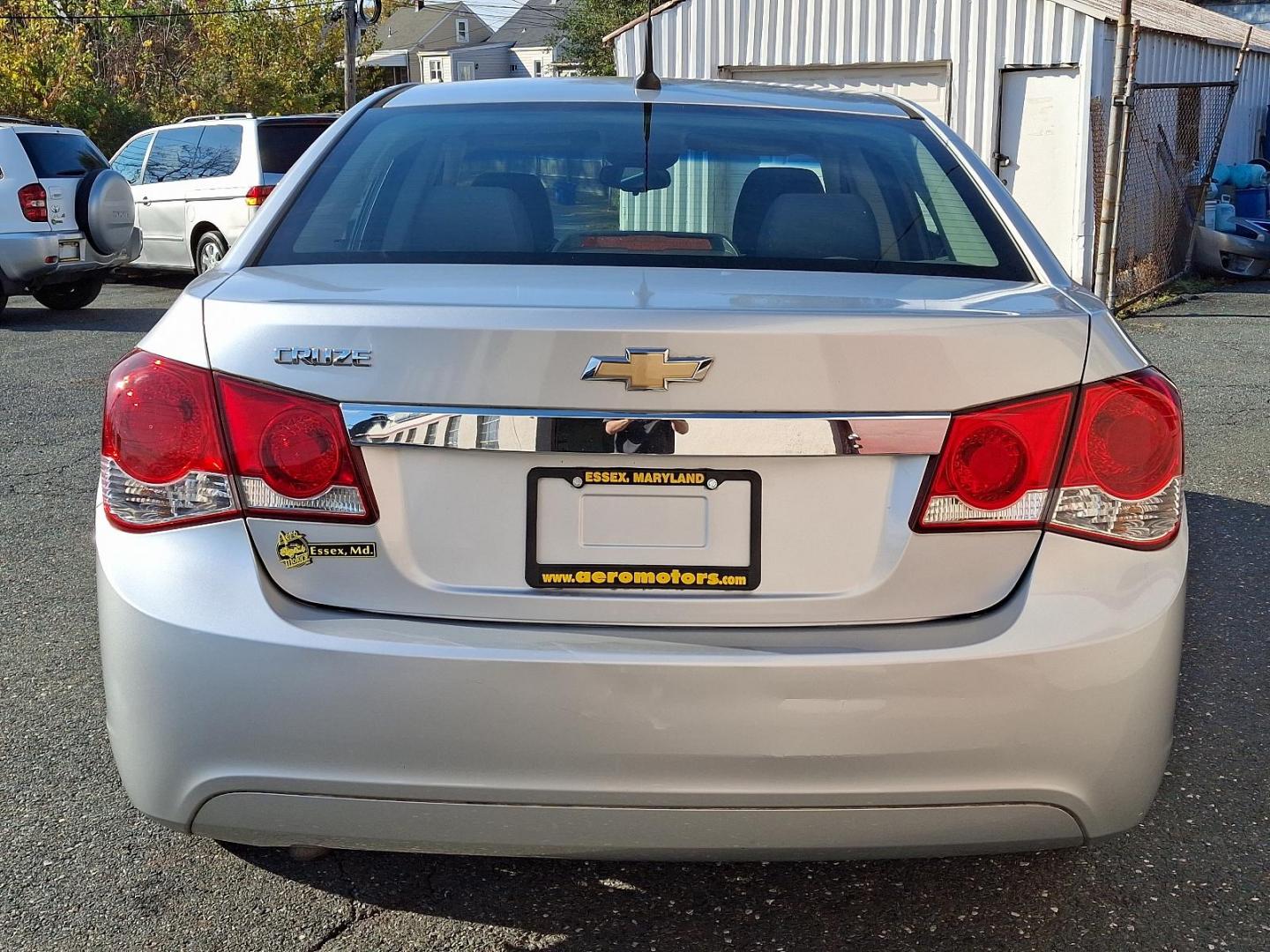 2011 Silver Ice Metallic - GAN /Jet Black/Medium Titanium - AFB Chevrolet Cruze LS (1G1PC5SH6B7) with an ENGINE, ECOTEC 1.8L VARIABLE VALVE TIMING DOHC 4-CYLINDER SEQUENTIAL MFI engine, located at 50 Eastern Blvd., Essex, MD, 21221, (410) 686-3444, 39.304367, -76.484947 - Discover the perfect blend of style and efficiency with this 2011 Chevrolet Cruze LS. Presented in a striking Silver Ice Metallic exterior, this four-door sedan is designed to turn heads while providing a comfortable and refined driving experience. Inside, you'll find a sophisticated Jet Black and M - Photo#4