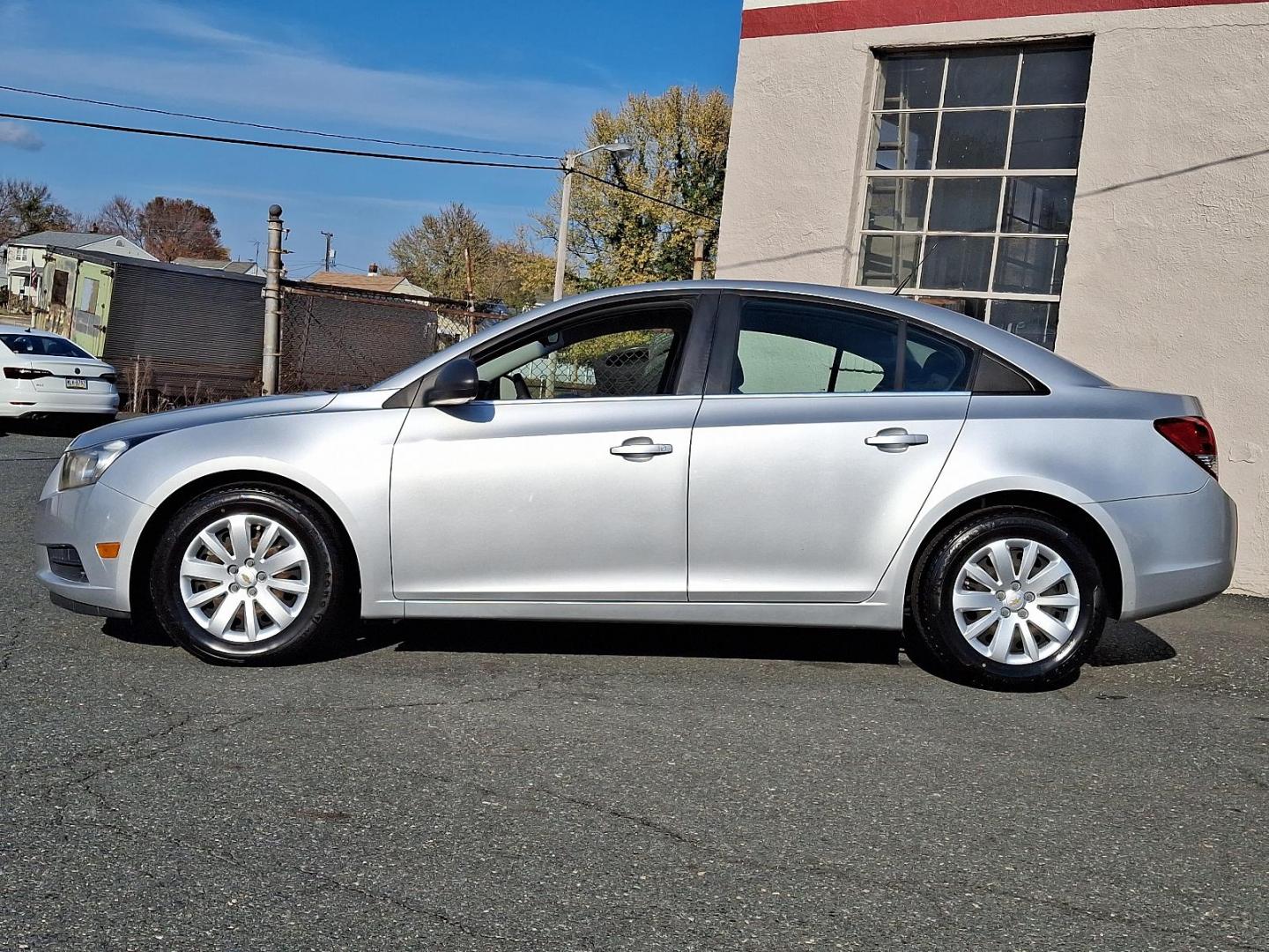 2011 Silver Ice Metallic - GAN /Jet Black/Medium Titanium - AFB Chevrolet Cruze LS (1G1PC5SH6B7) with an ENGINE, ECOTEC 1.8L VARIABLE VALVE TIMING DOHC 4-CYLINDER SEQUENTIAL MFI engine, located at 50 Eastern Blvd., Essex, MD, 21221, (410) 686-3444, 39.304367, -76.484947 - Discover the perfect blend of style and efficiency with this 2011 Chevrolet Cruze LS. Presented in a striking Silver Ice Metallic exterior, this four-door sedan is designed to turn heads while providing a comfortable and refined driving experience. Inside, you'll find a sophisticated Jet Black and M - Photo#6