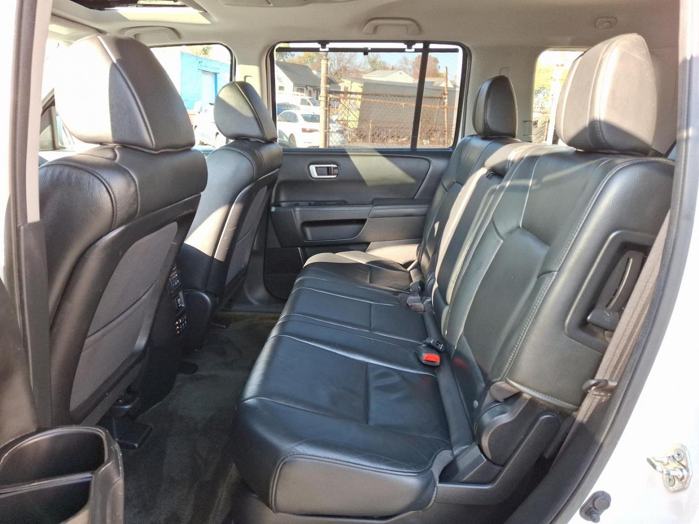 2014 White Diamond Pearl - WA /Black - BK Honda Pilot Touring (5FNYF4H97EB) with an Engine: 3.5L V6 24-Valve SOHC i-VTEC engine, located at 50 Eastern Blvd., Essex, MD, 21221, (410) 686-3444, 39.304367, -76.484947 - Experience the perfect blend of style, comfort, and versatility with the 2014 Honda Pilot Touring 4WD. This sophisticated SUV is finished in a pristine white exterior, exuding elegance and modernity. Powered by a robust 3.5L V6 24-valve SOHC i-VTEC engine, the Pilot delivers a smooth and responsive - Photo#9