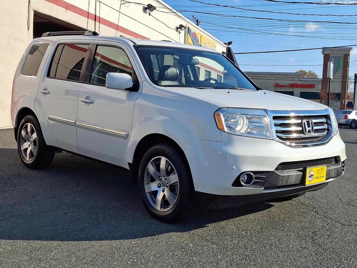 2014 White Diamond Pearl - WA /Black - BK Honda Pilot Touring (5FNYF4H97EB) with an Engine: 3.5L V6 24-Valve SOHC i-VTEC engine, located at 50 Eastern Blvd., Essex, MD, 21221, (410) 686-3444, 39.304367, -76.484947 - Experience the perfect blend of style, comfort, and versatility with the 2014 Honda Pilot Touring 4WD. This sophisticated SUV is finished in a pristine white exterior, exuding elegance and modernity. Powered by a robust 3.5L V6 24-valve SOHC i-VTEC engine, the Pilot delivers a smooth and responsive - Photo#2