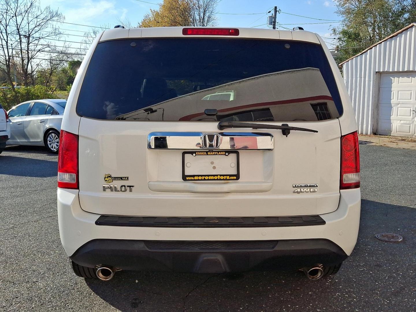 2014 White Diamond Pearl - WA /Black - BK Honda Pilot Touring (5FNYF4H97EB) with an Engine: 3.5L V6 24-Valve SOHC i-VTEC engine, located at 50 Eastern Blvd., Essex, MD, 21221, (410) 686-3444, 39.304367, -76.484947 - Experience the perfect blend of style, comfort, and versatility with the 2014 Honda Pilot Touring 4WD. This sophisticated SUV is finished in a pristine white exterior, exuding elegance and modernity. Powered by a robust 3.5L V6 24-valve SOHC i-VTEC engine, the Pilot delivers a smooth and responsive - Photo#4