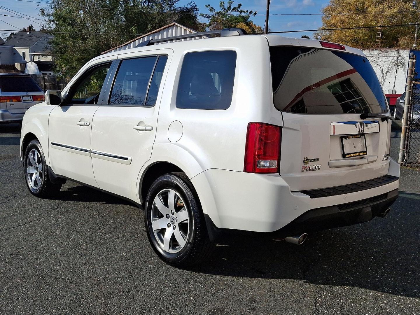 2014 White Diamond Pearl - WA /Black - BK Honda Pilot Touring (5FNYF4H97EB) with an Engine: 3.5L V6 24-Valve SOHC i-VTEC engine, located at 50 Eastern Blvd., Essex, MD, 21221, (410) 686-3444, 39.304367, -76.484947 - Experience the perfect blend of style, comfort, and versatility with the 2014 Honda Pilot Touring 4WD. This sophisticated SUV is finished in a pristine white exterior, exuding elegance and modernity. Powered by a robust 3.5L V6 24-valve SOHC i-VTEC engine, the Pilot delivers a smooth and responsive - Photo#5