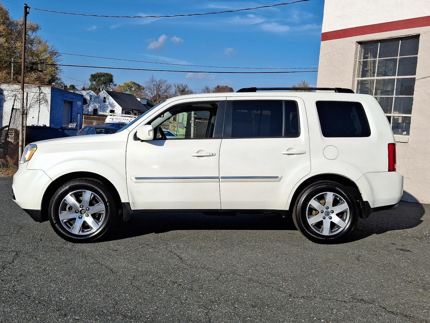 2014 White Diamond Pearl - WA /Black - BK Honda Pilot Touring (5FNYF4H97EB) with an Engine: 3.5L V6 24-Valve SOHC i-VTEC engine, located at 50 Eastern Blvd., Essex, MD, 21221, (410) 686-3444, 39.304367, -76.484947 - Experience the perfect blend of style, comfort, and versatility with the 2014 Honda Pilot Touring 4WD. This sophisticated SUV is finished in a pristine white exterior, exuding elegance and modernity. Powered by a robust 3.5L V6 24-valve SOHC i-VTEC engine, the Pilot delivers a smooth and responsive - Photo#6