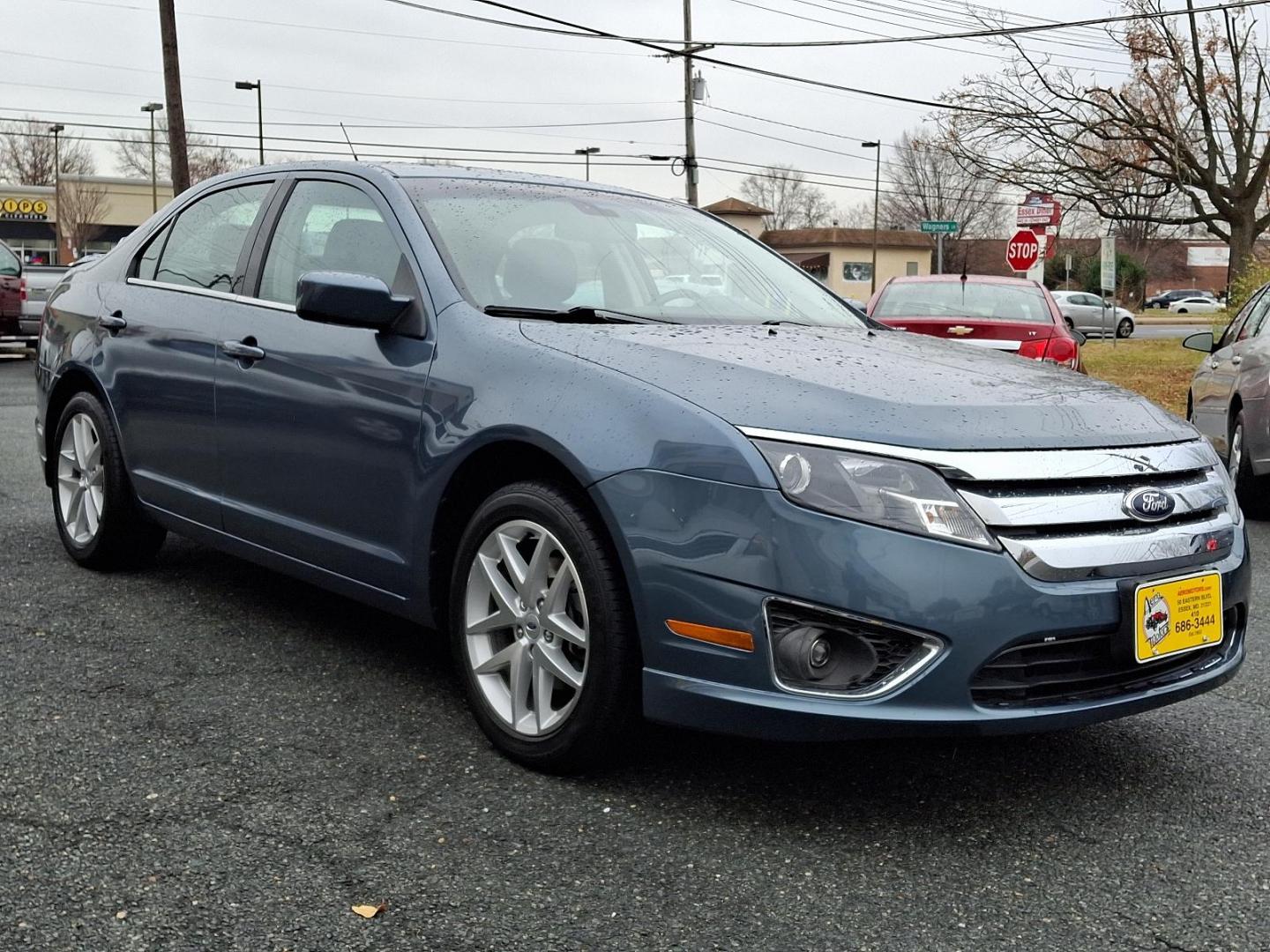 2012 Steel Blue Metallic - UN /Charcoal Black - FW Ford Fusion SEL (3FAHP0JG4CR) with an 3.0L 24V V6 DURATEC FLEX FUEL ENGINE engine, located at 50 Eastern Blvd., Essex, MD, 21221, (410) 686-3444, 39.304367, -76.484947 - Introducing the 2012 Ford Fusion SEL, a stylish and reliable sedan that combines performance with practicality. This elegant blue 4-door vehicle is powered by a robust 3.0L 24V V6 Duratec flex-fuel engine, delivering both power and efficiency for your daily commutes and weekend getaways. The Fusio - Photo#2