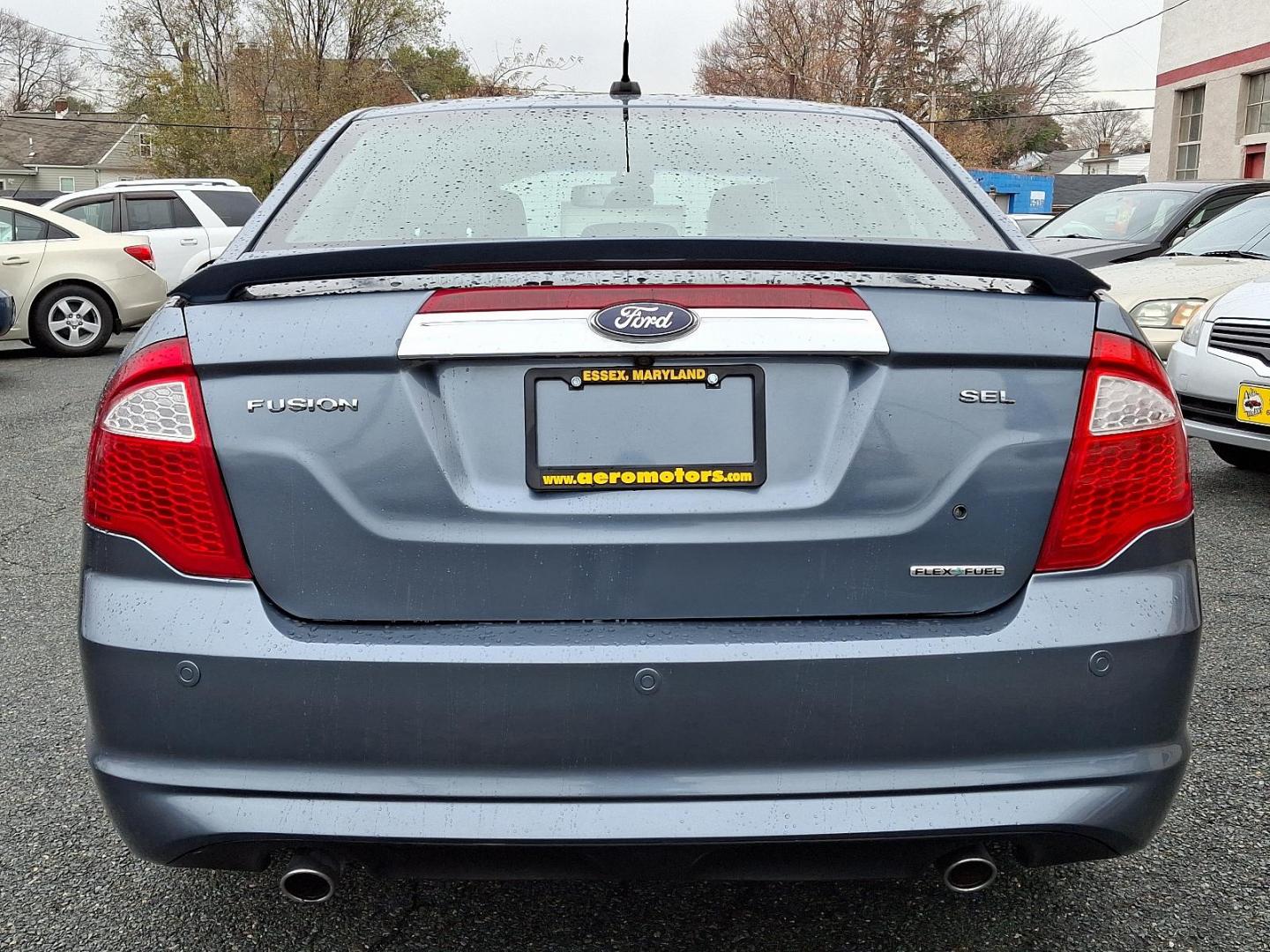 2012 Steel Blue Metallic - UN /Charcoal Black - FW Ford Fusion SEL (3FAHP0JG4CR) with an 3.0L 24V V6 DURATEC FLEX FUEL ENGINE engine, located at 50 Eastern Blvd., Essex, MD, 21221, (410) 686-3444, 39.304367, -76.484947 - Introducing the 2012 Ford Fusion SEL, a stylish and reliable sedan that combines performance with practicality. This elegant blue 4-door vehicle is powered by a robust 3.0L 24V V6 Duratec flex-fuel engine, delivering both power and efficiency for your daily commutes and weekend getaways. The Fusio - Photo#4