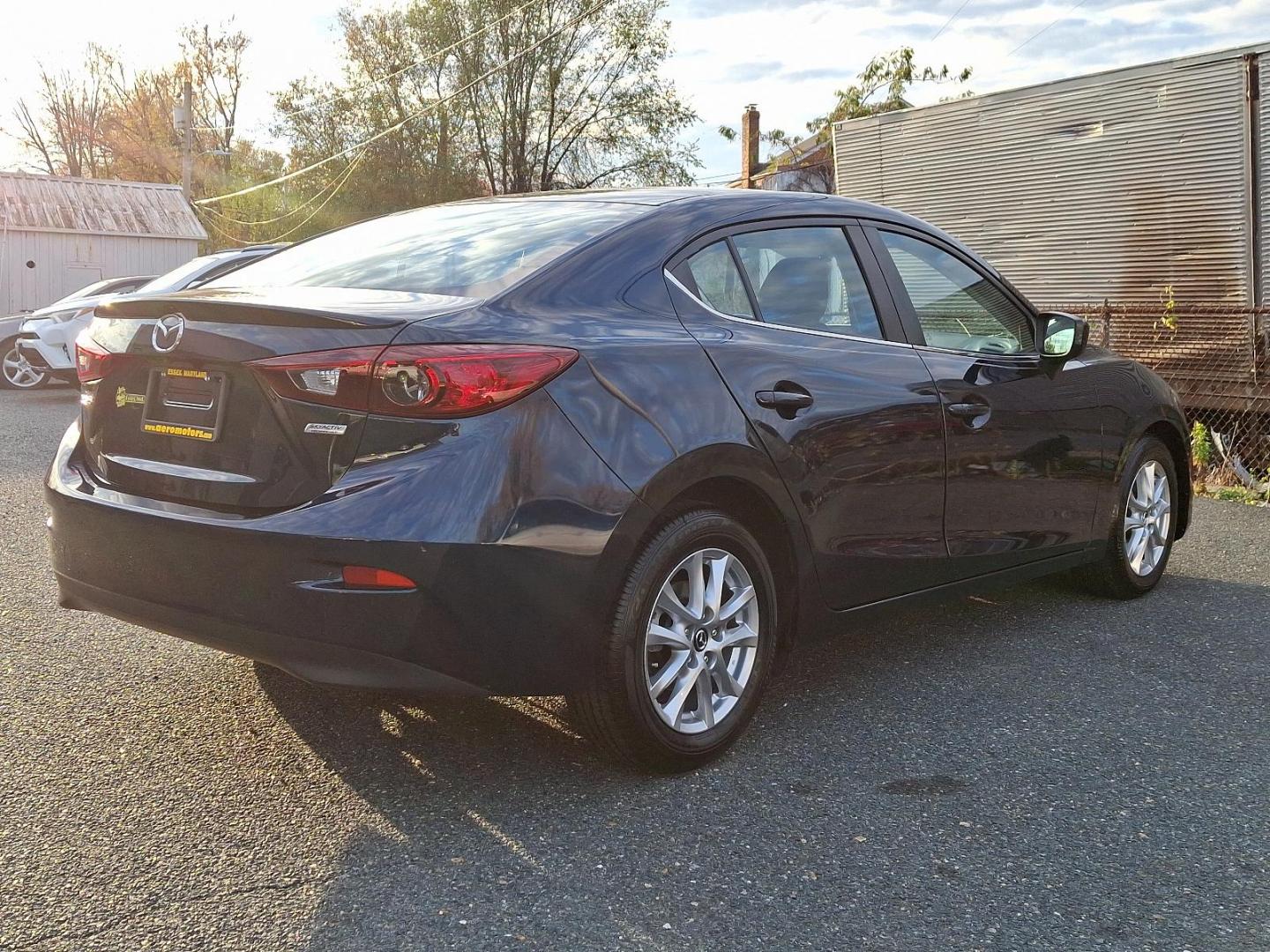 2015 Deep Crystal Blue Mica - 42M /Black - BV0 Mazda Mazda3 i Touring (3MZBM1V74FM) with an Engine: 2.0L SKYACTIV-G DOHC 16-Valve 4-Cylinder -inc: variable valve timing engine, located at 50 Eastern Blvd., Essex, MD, 21221, (410) 686-3444, 39.304367, -76.484947 - Discover the perfect blend of style and performance with this 2015 Mazda Mazda3 i Touring. Finished in a captivating Deep Crystal Blue Mica exterior, this sedan is designed to turn heads while providing an exhilarating driving experience. Inside, the refined black interior offers a comfortable and m - Photo#3