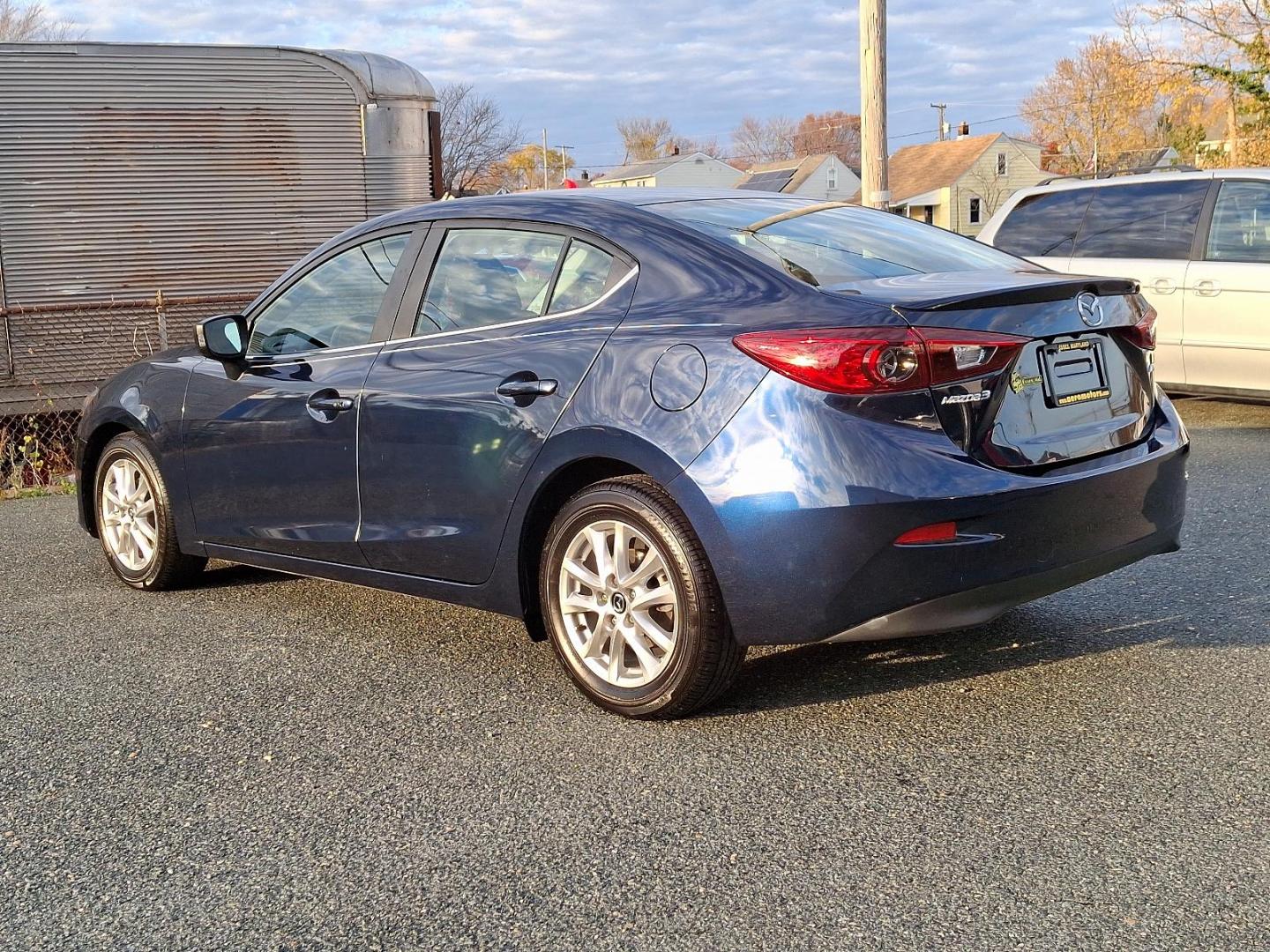 2015 Deep Crystal Blue Mica - 42M /Black - BV0 Mazda Mazda3 i Touring (3MZBM1V74FM) with an Engine: 2.0L SKYACTIV-G DOHC 16-Valve 4-Cylinder -inc: variable valve timing engine, located at 50 Eastern Blvd., Essex, MD, 21221, (410) 686-3444, 39.304367, -76.484947 - Discover the perfect blend of style and performance with this 2015 Mazda Mazda3 i Touring. Finished in a captivating Deep Crystal Blue Mica exterior, this sedan is designed to turn heads while providing an exhilarating driving experience. Inside, the refined black interior offers a comfortable and m - Photo#5