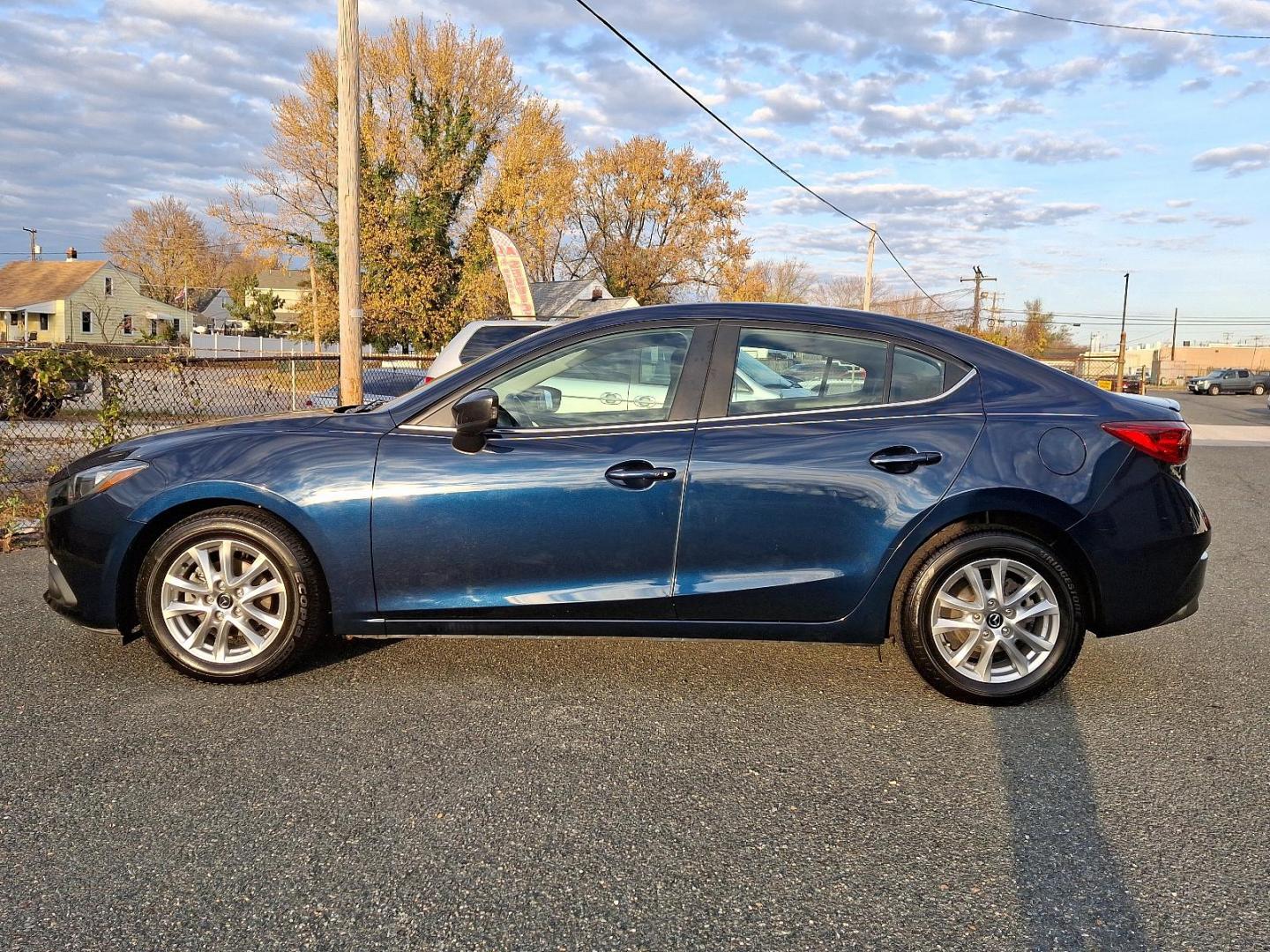 2015 Deep Crystal Blue Mica - 42M /Black - BV0 Mazda Mazda3 i Touring (3MZBM1V74FM) with an Engine: 2.0L SKYACTIV-G DOHC 16-Valve 4-Cylinder -inc: variable valve timing engine, located at 50 Eastern Blvd., Essex, MD, 21221, (410) 686-3444, 39.304367, -76.484947 - Discover the perfect blend of style and performance with this 2015 Mazda Mazda3 i Touring. Finished in a captivating Deep Crystal Blue Mica exterior, this sedan is designed to turn heads while providing an exhilarating driving experience. Inside, the refined black interior offers a comfortable and m - Photo#6