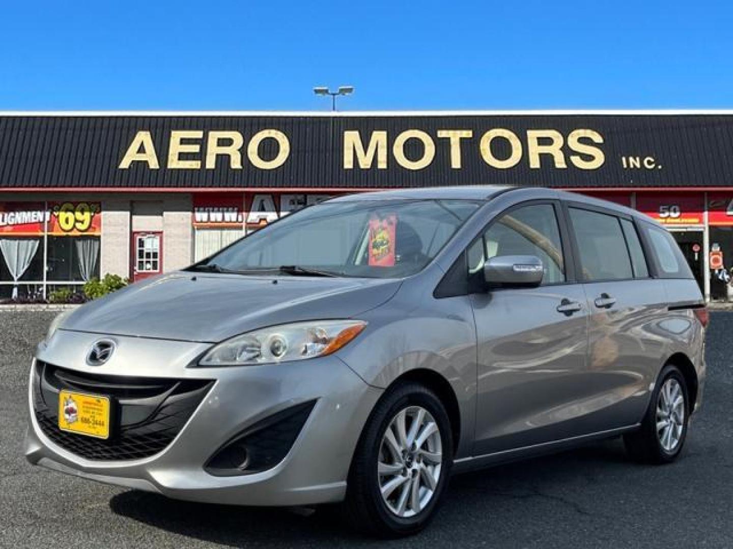 2013 Liquid Silver Metallic Mazda Mazda5 Sport (JM1CW2BL0D0) with an 2.5L 2.5L I4 157hp 163ft. lbs. Fuel Injected engine, 5-Speed Automatic with Sportshift Manual 5A transmission, located at 50 Eastern Blvd., Essex, MD, 21221, (410) 686-3444, 39.304367, -76.484947 - Photo#0