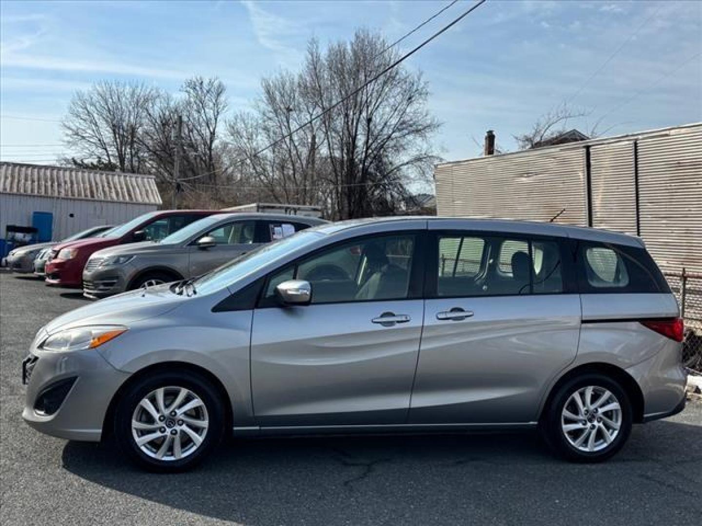 2013 Liquid Silver Metallic Mazda Mazda5 Sport (JM1CW2BL0D0) with an 2.5L 2.5L I4 157hp 163ft. lbs. Fuel Injected engine, 5-Speed Automatic with Sportshift Manual 5A transmission, located at 50 Eastern Blvd., Essex, MD, 21221, (410) 686-3444, 39.304367, -76.484947 - Photo#1