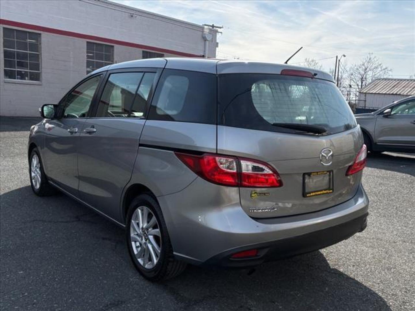 2013 Liquid Silver Metallic Mazda Mazda5 Sport (JM1CW2BL0D0) with an 2.5L 2.5L I4 157hp 163ft. lbs. Fuel Injected engine, 5-Speed Automatic with Sportshift Manual 5A transmission, located at 50 Eastern Blvd., Essex, MD, 21221, (410) 686-3444, 39.304367, -76.484947 - Photo#2