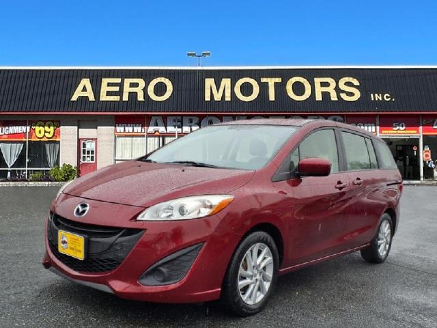 2012 Copper Red Mica Mazda Mazda5 Sport (JM1CW2BL0C0) with an 2.5L 2.5L I4 157hp 163ft. lbs. Fuel Injected engine, 5-Speed Automatic with Sportshift Manual 5A transmission, located at 50 Eastern Blvd., Essex, MD, 21221, (410) 686-3444, 39.304367, -76.484947 - Photo#0