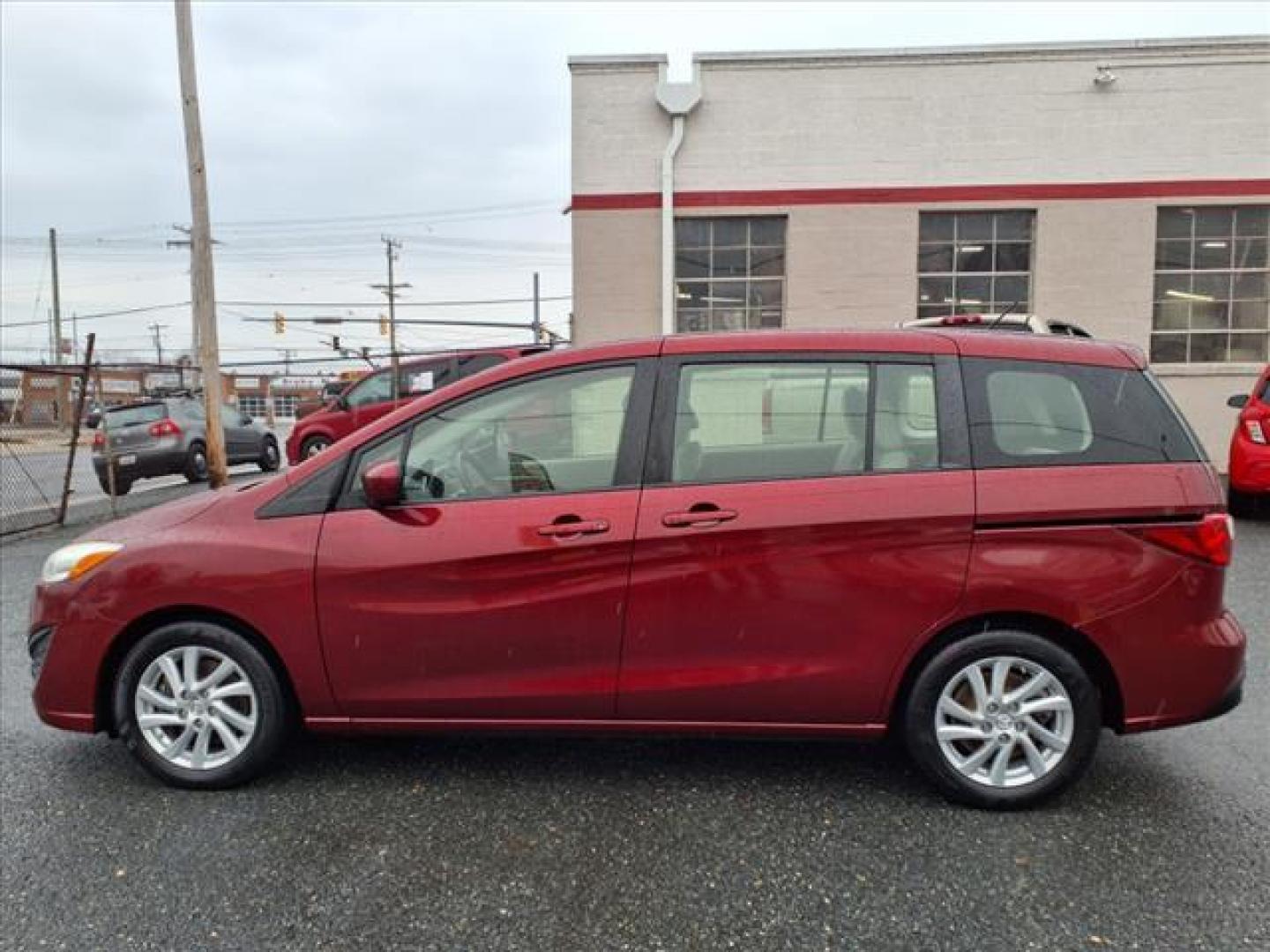 2012 Copper Red Mica Mazda Mazda5 Sport (JM1CW2BL0C0) with an 2.5L 2.5L I4 157hp 163ft. lbs. Fuel Injected engine, 5-Speed Automatic with Sportshift Manual 5A transmission, located at 50 Eastern Blvd., Essex, MD, 21221, (410) 686-3444, 39.304367, -76.484947 - Photo#1