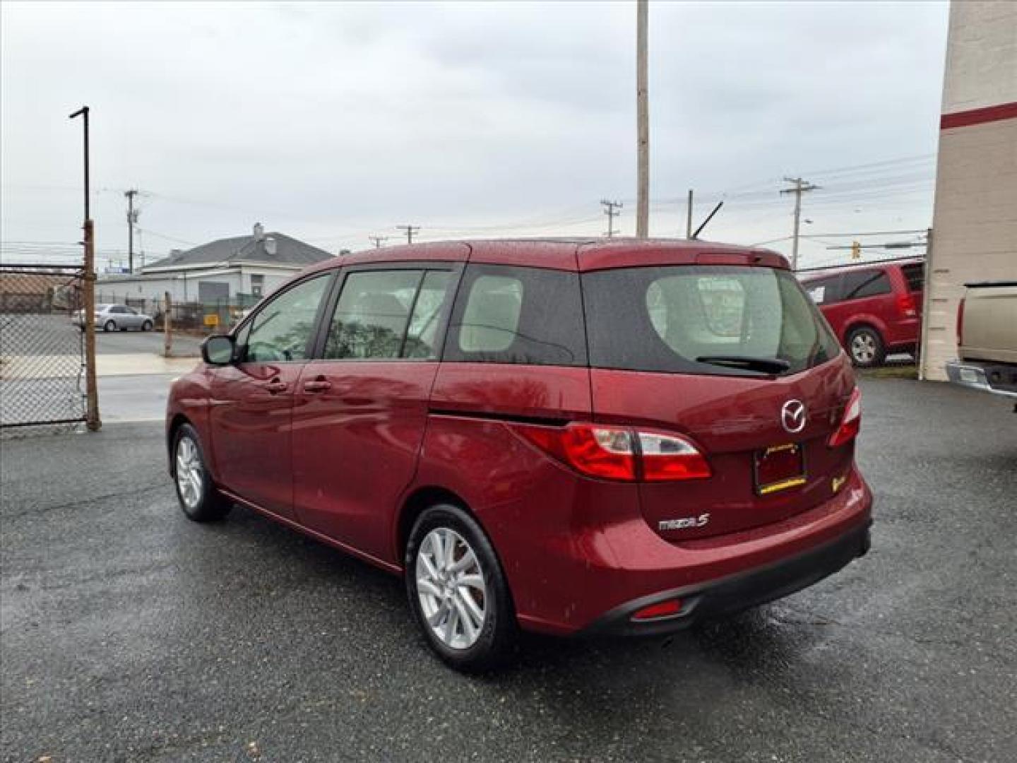 2012 Copper Red Mica Mazda Mazda5 Sport (JM1CW2BL0C0) with an 2.5L 2.5L I4 157hp 163ft. lbs. Fuel Injected engine, 5-Speed Automatic with Sportshift Manual 5A transmission, located at 50 Eastern Blvd., Essex, MD, 21221, (410) 686-3444, 39.304367, -76.484947 - Photo#2