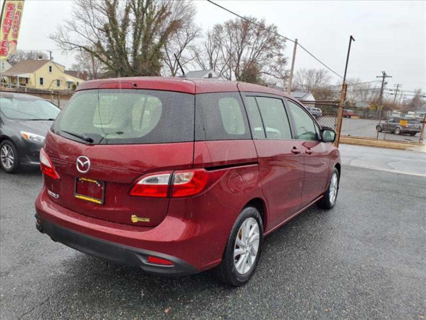 2012 Copper Red Mica Mazda Mazda5 Sport (JM1CW2BL0C0) with an 2.5L 2.5L I4 157hp 163ft. lbs. Fuel Injected engine, 5-Speed Automatic with Sportshift Manual 5A transmission, located at 50 Eastern Blvd., Essex, MD, 21221, (410) 686-3444, 39.304367, -76.484947 - Photo#5