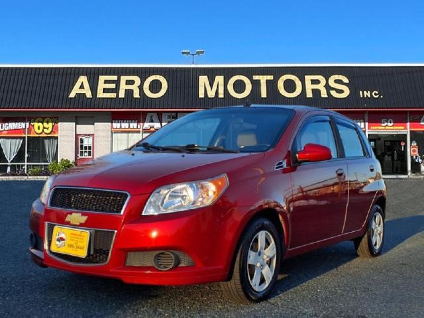 2009 Victory Red Chevrolet Aveo Aveo5 LS (KL1TD66E49B) with an 1.6L ECOTEC 1.6L I4 106hp 105ft. lbs. Sequential-Port F.I. engine, 5-Speed Manual transmission, located at 50 Eastern Blvd., Essex, MD, 21221, (410) 686-3444, 39.304367, -76.484947 - Photo#0