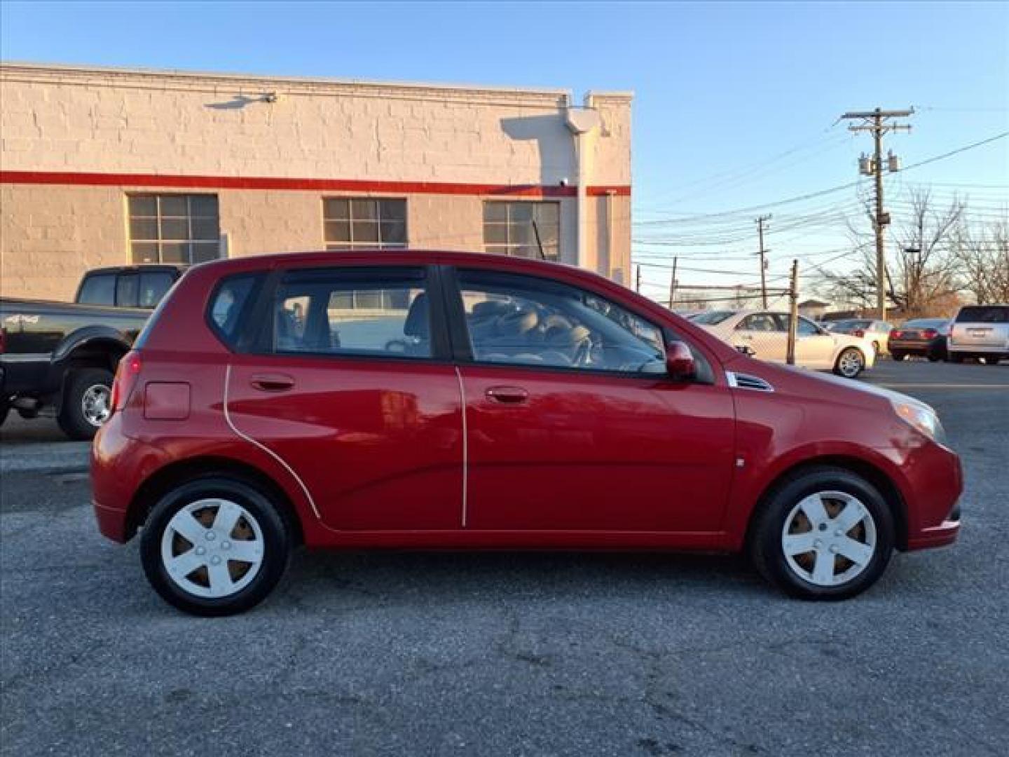 2009 Victory Red Chevrolet Aveo Aveo5 LS (KL1TD66E49B) with an 1.6L ECOTEC 1.6L I4 106hp 105ft. lbs. Sequential-Port F.I. engine, 5-Speed Manual transmission, located at 50 Eastern Blvd., Essex, MD, 21221, (410) 686-3444, 39.304367, -76.484947 - Photo#5